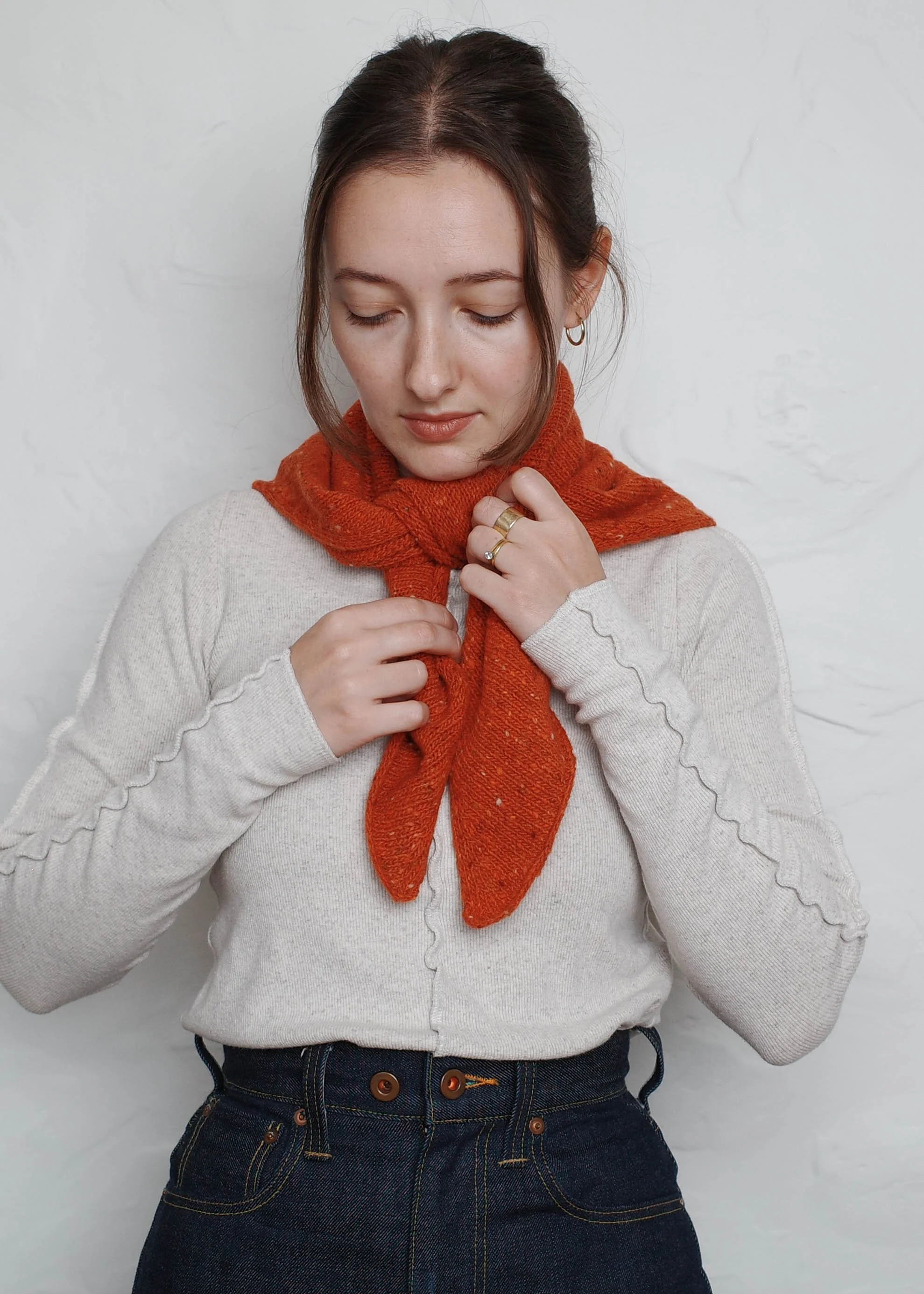 XL Knit Bandana in Lobster Red, being tied at the front