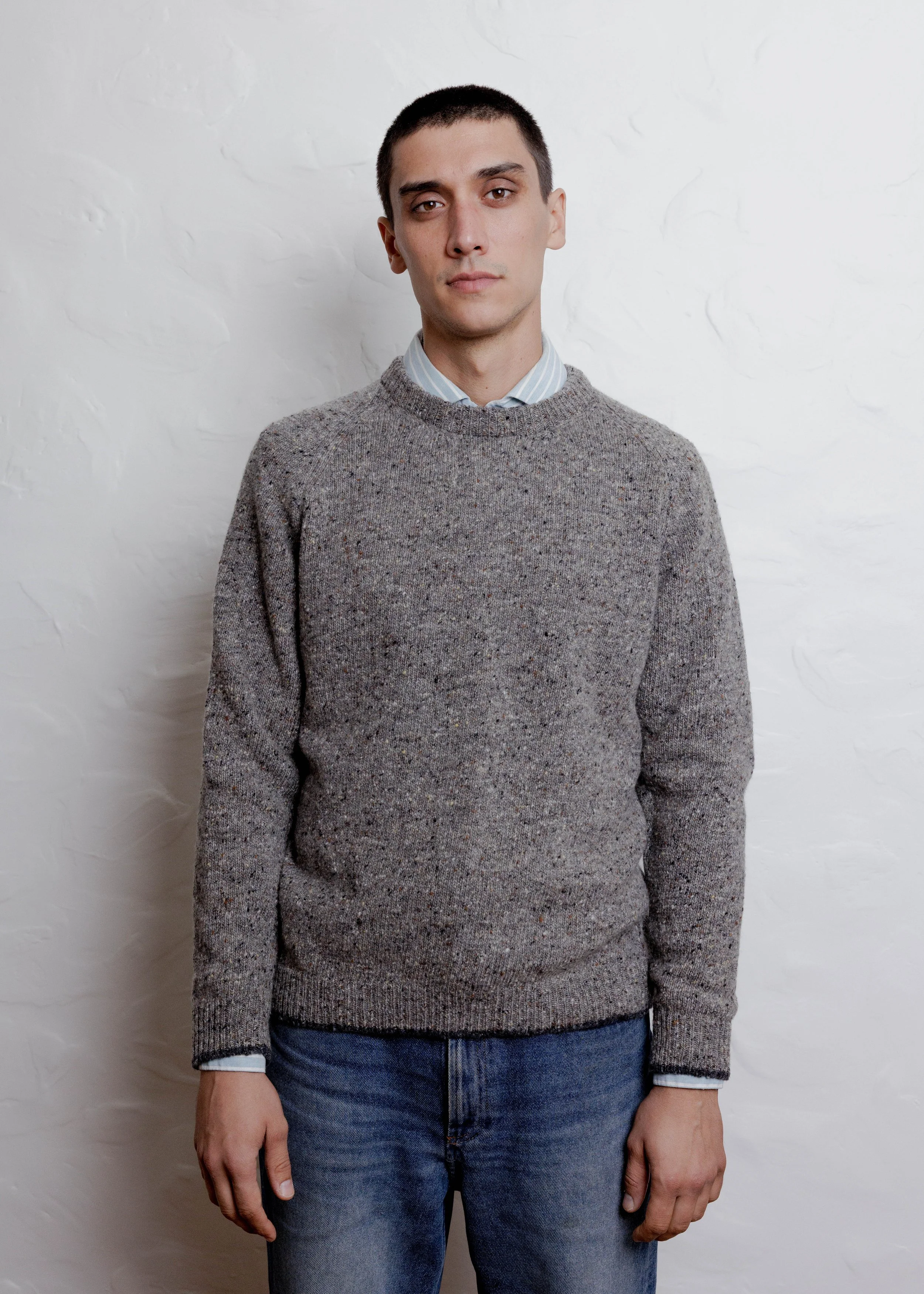 Everyday Raglan sweater in Stone, front view, worn over a collared shirt