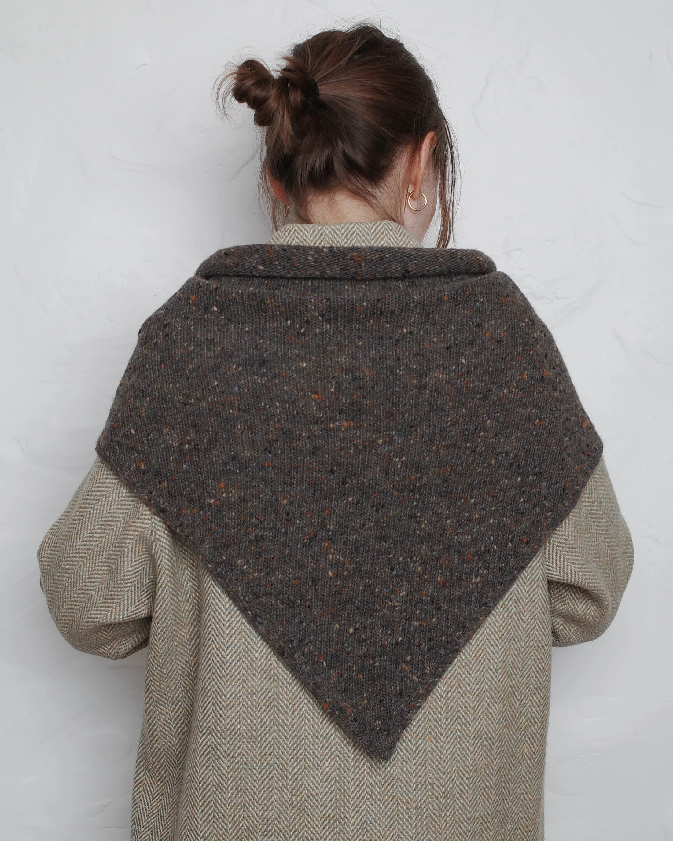 XL Knit Bandana in Umber, draped over the shoulders of a coat, back view