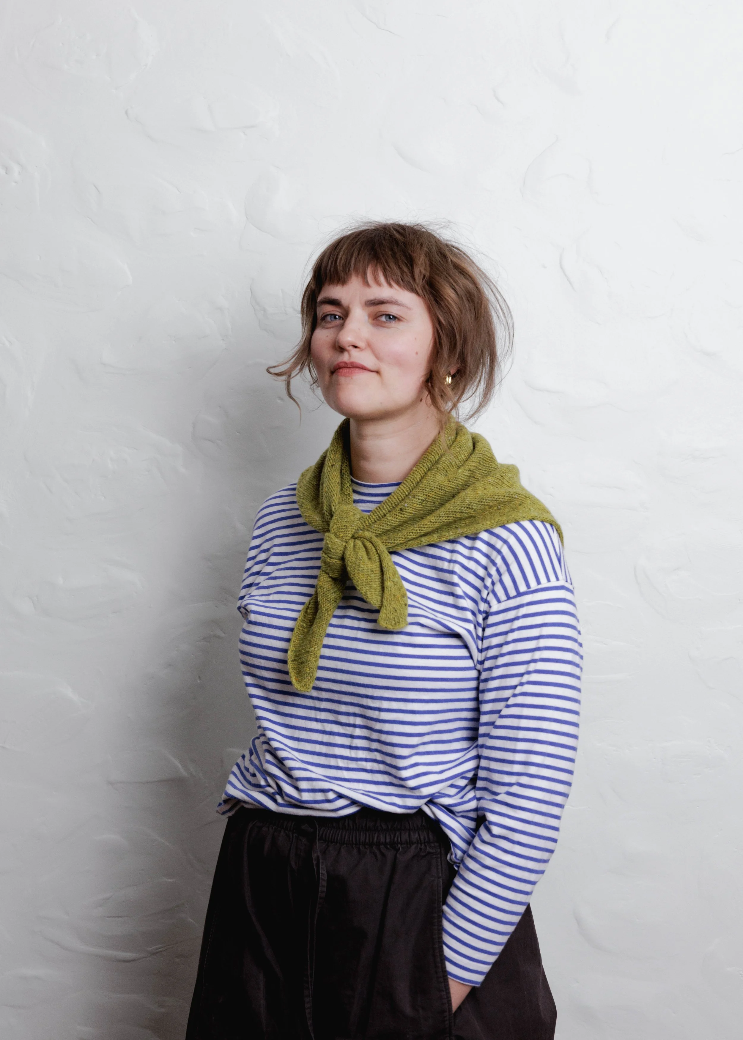 XL Knit Bandana in Lime Green, tied as a neckerchief with a striped top