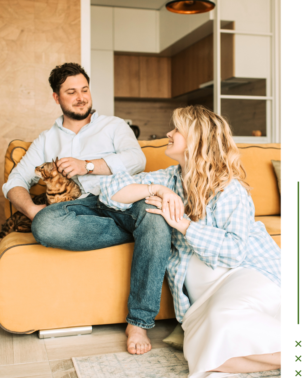 A man sitting petting a cat while his partner smiles & leans on him. Couples therapy in Portland, OR is here to support individuals & couples. Learn more here on how therapy can help you reconnect.