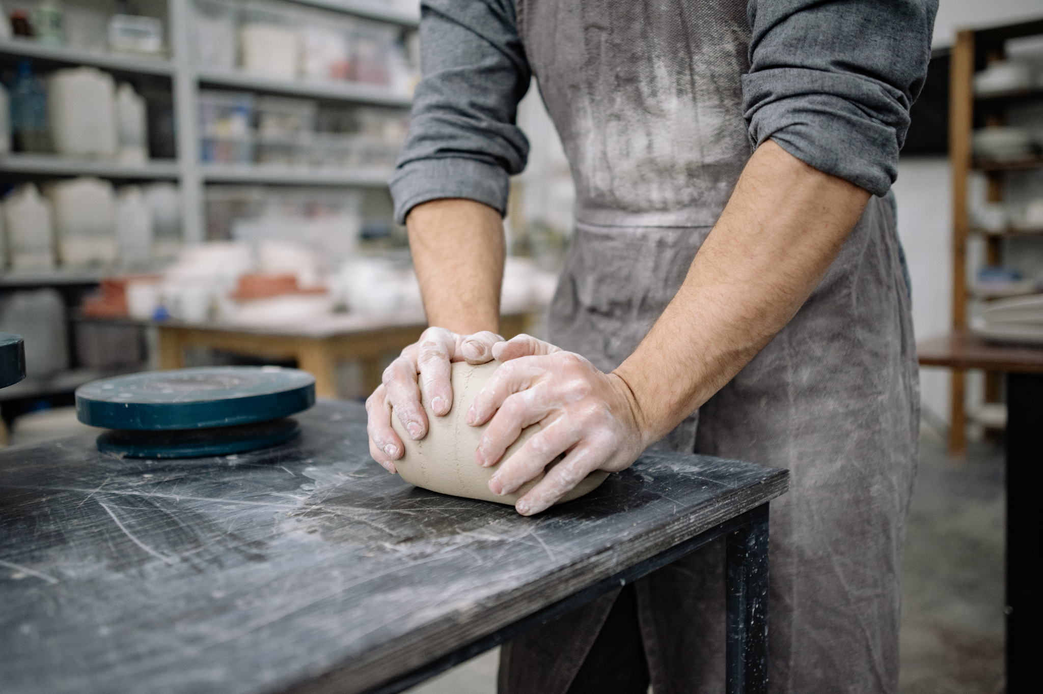 A potter kneads clay, symbolizing the effort to reshape relationships. learn about online programs for marriage and family therapy help you help others in molding a healthier future in Portland, Oregon. We serve zip code 97229.