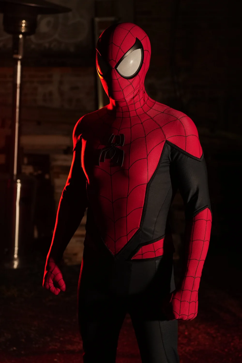 Spider-Man in dramatic red lighting from Hardman Media's original film production