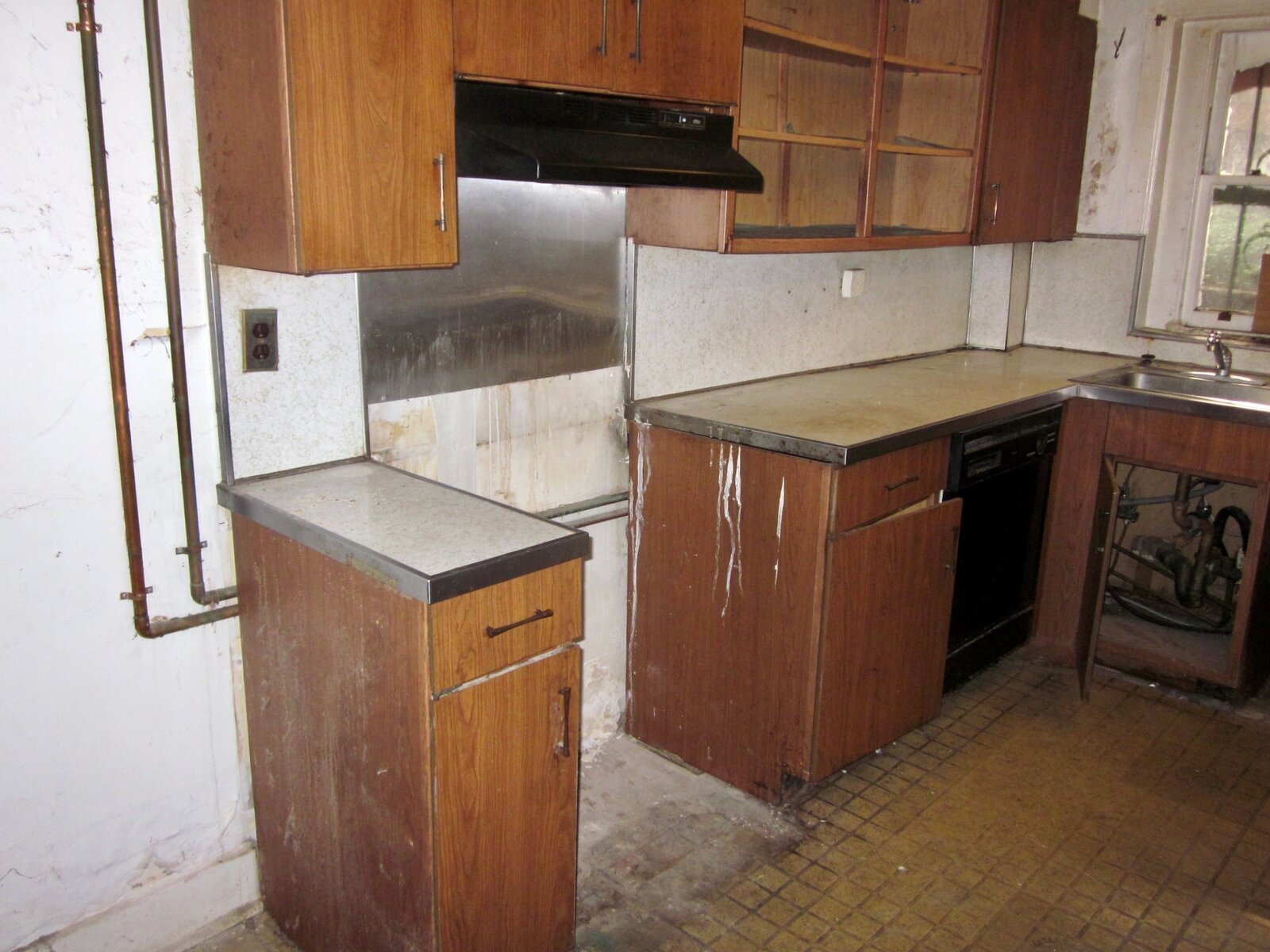  Before: The original kitchen was in the back of the basement. 