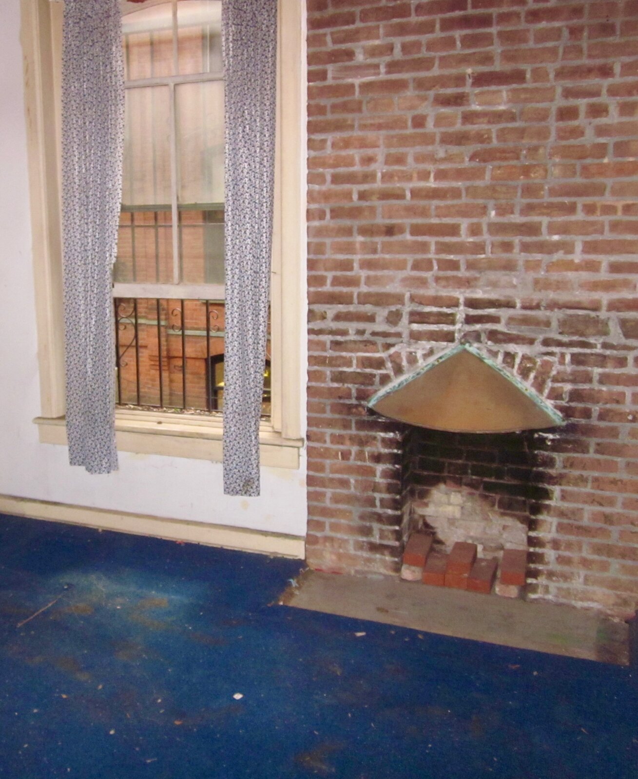  Before: The team refurbished the chimney in the front portion of the house because Priscilla really wanted a fireplace. 