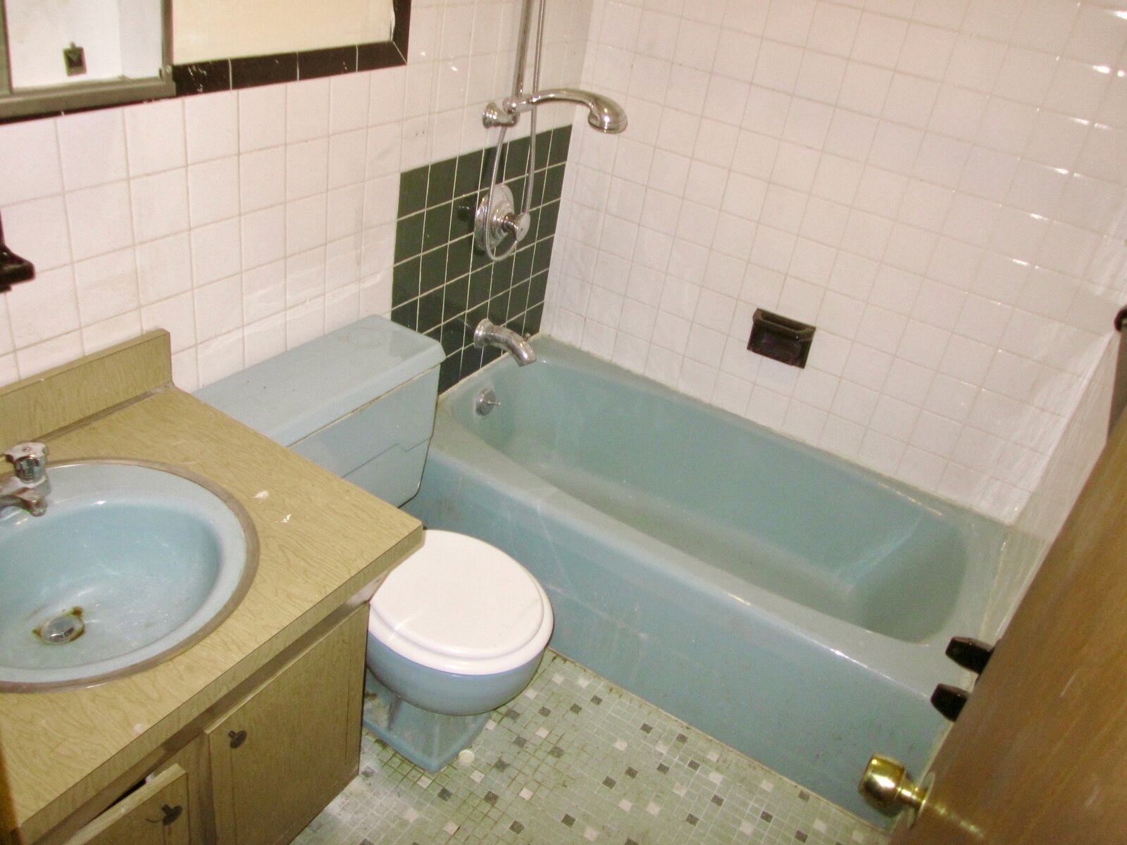  Before: The team demolished the powder blue bath on the first floor and added a new bath in the basement. 