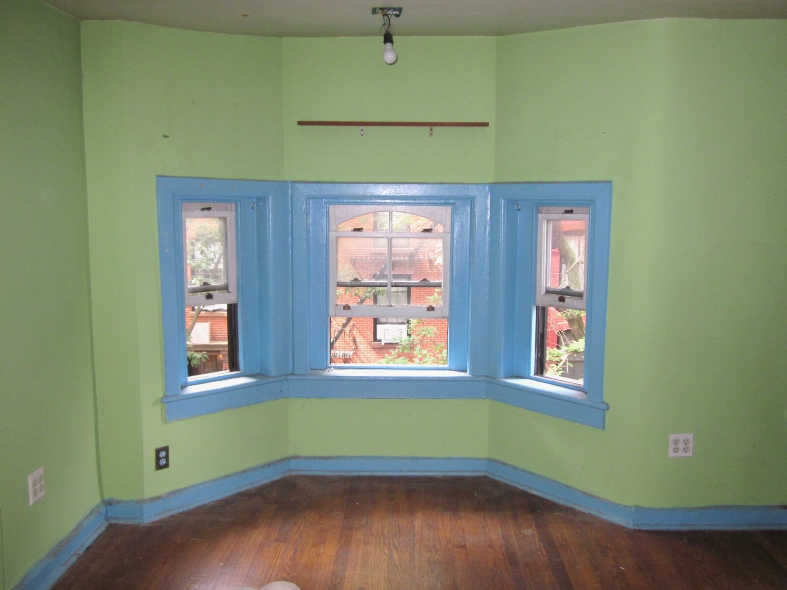  Before: The front bedroom on the third floor sported quite the color combination. 