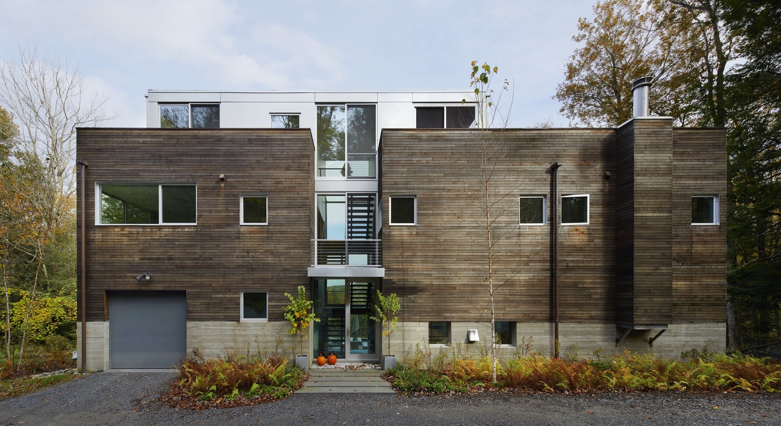   Shiplapped red cedar was the Diamonds’ material of choice for their Berkshires home. The prefab home is also constructed with concrete and aluminum.  