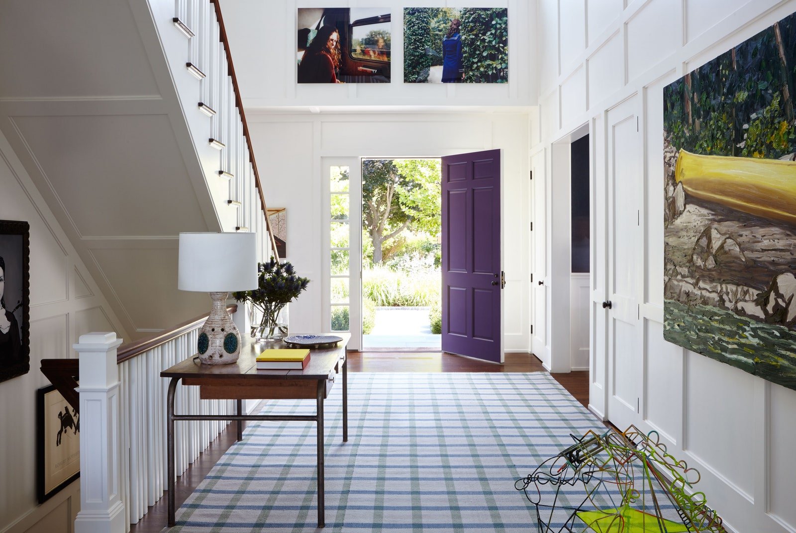  “She also loves plaid. The runner does a nice job of pulling all of the colors from the main floor together,” says Brown of the custom wool rug by Sacco Carpets. He sourced the vintage table and lamp from Robert Stilin’s East Hampton shop, and the p