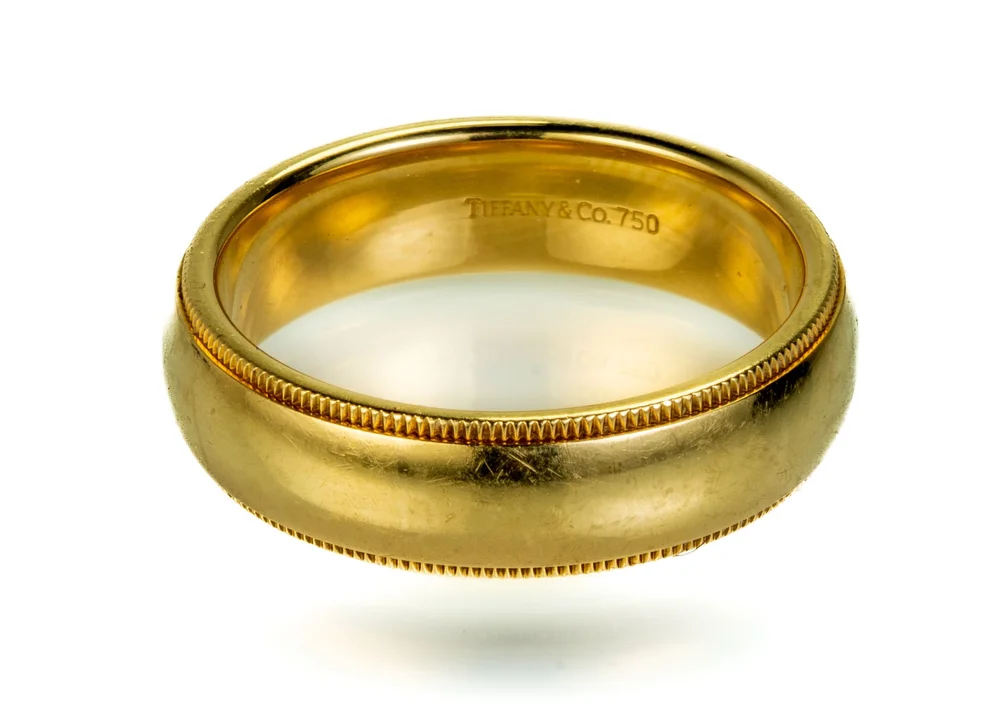 Lot 36: Tiffany and Co. 18k Gold Men's Wedding Band