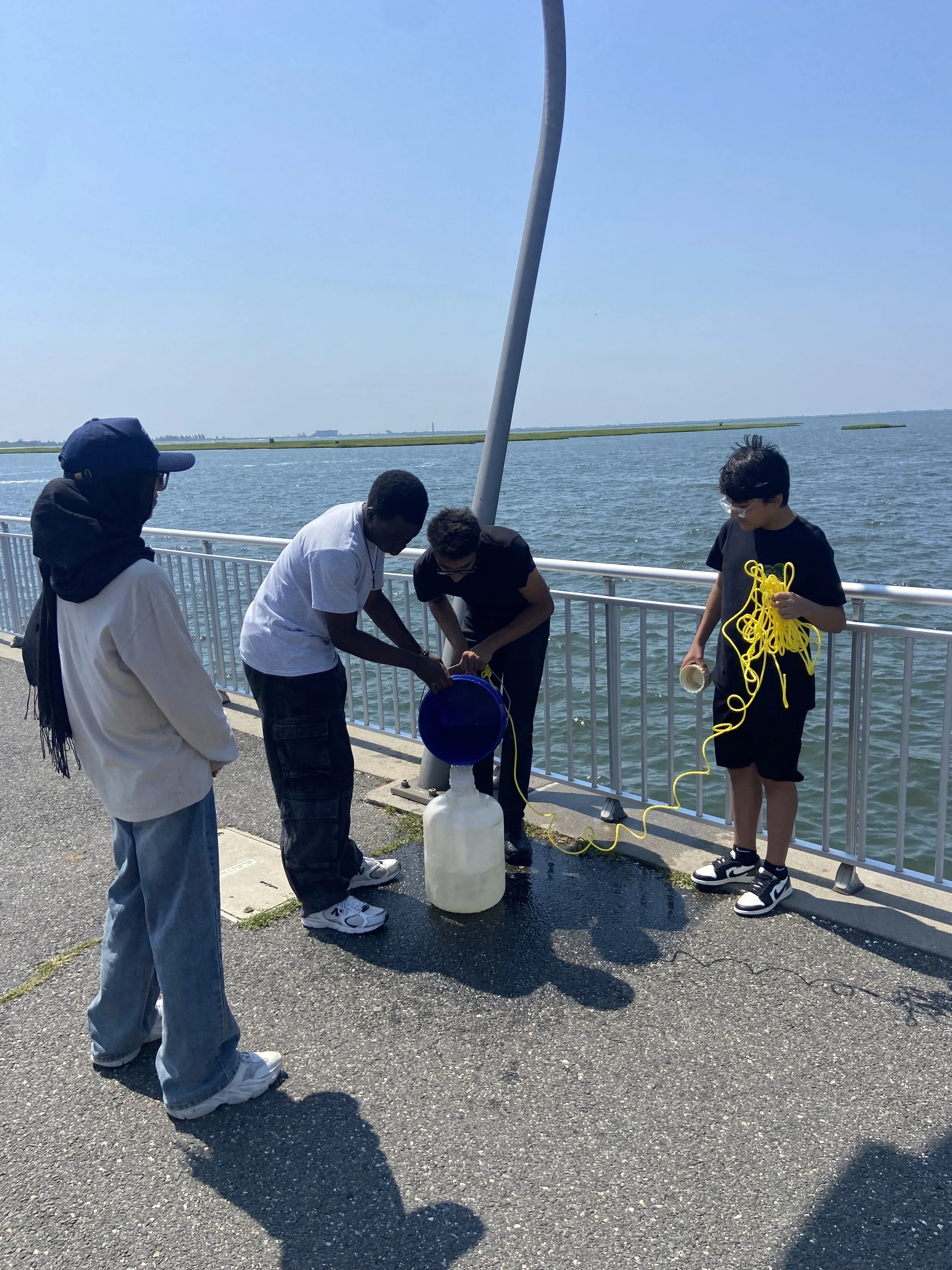 Collecting sea water to run experiments in the lab. 