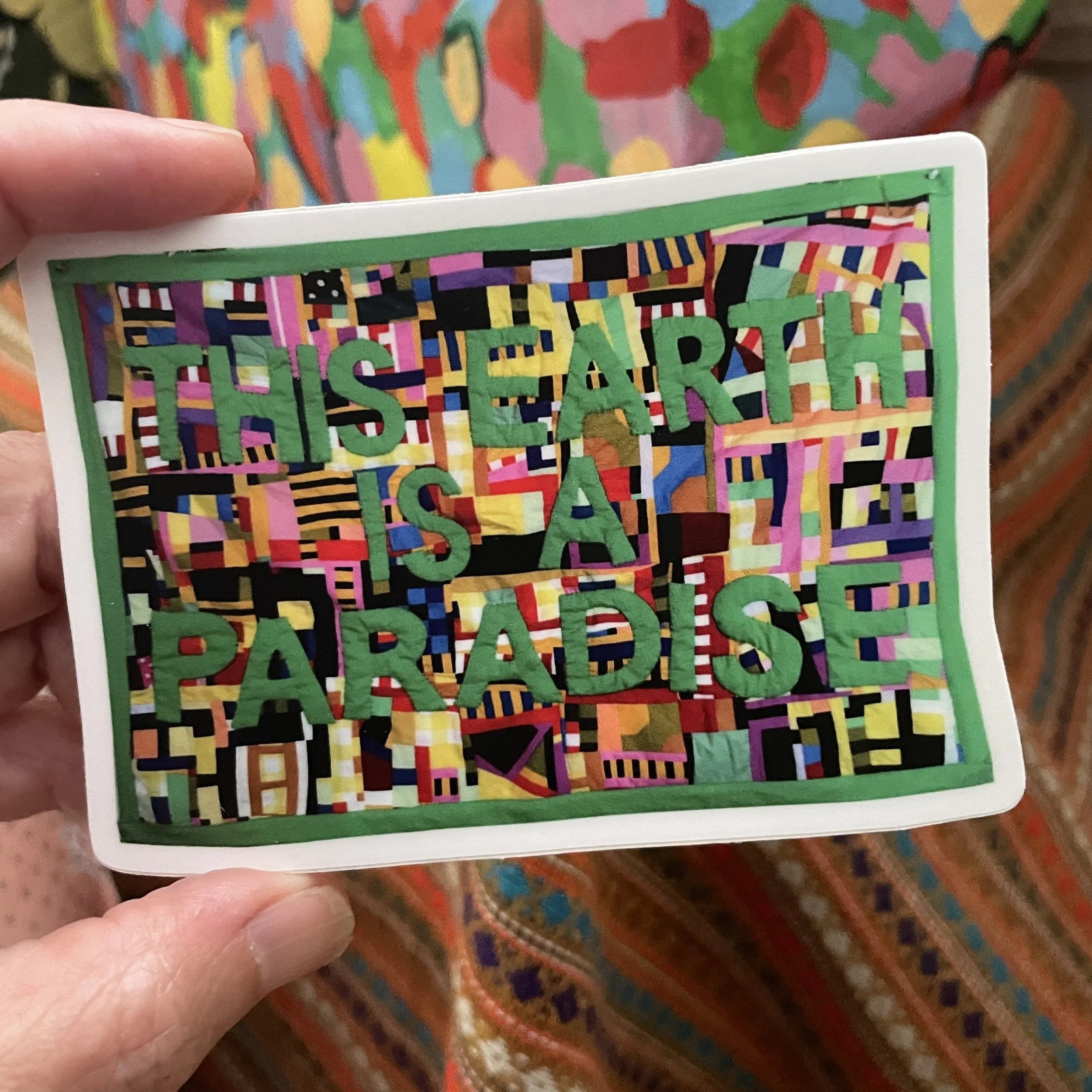 this earth is a paradise sticker.jpg