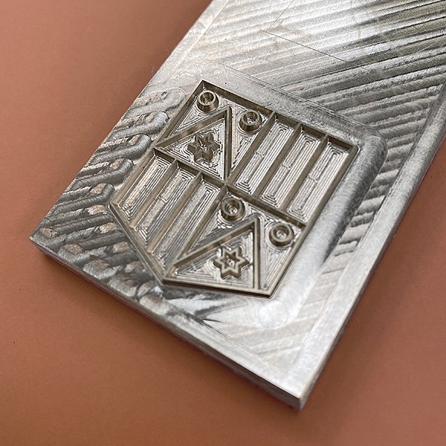 WdM_FamilyShield_GoldFoilDie_640.jpg