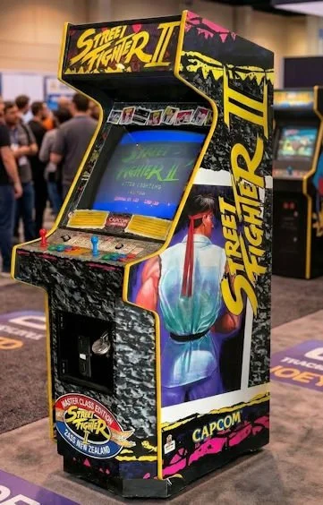 Street Fighter arcade game in busy function room
