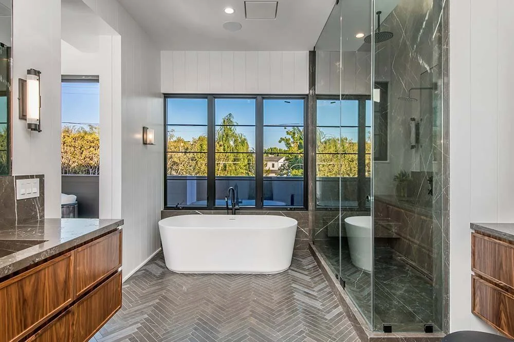 Warm wood and marble accents in a luxury Brentwood bathroom.