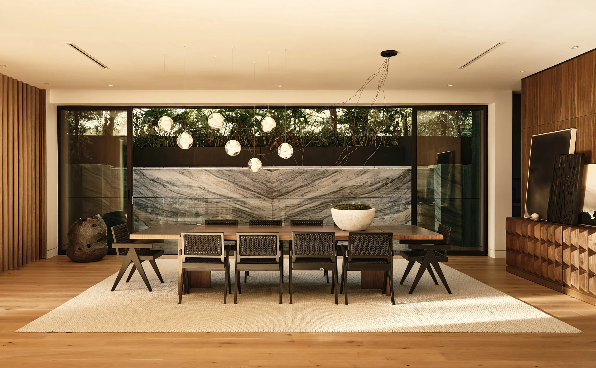 Open-concept living room in a newly developed Brentwood residence, showcasing wide-plank oak floors and expansive glass doors..jpg
