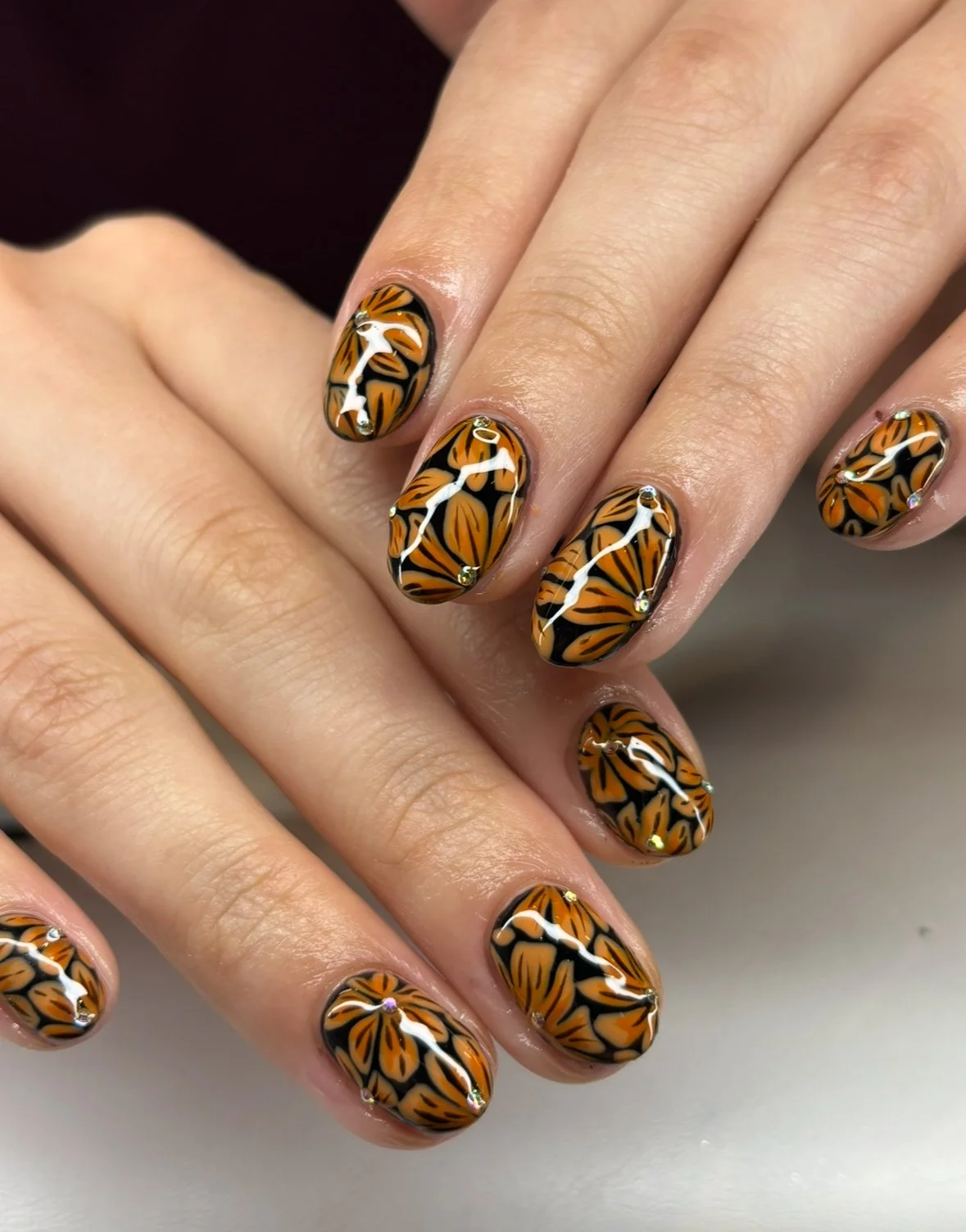 orange flower nails.jpeg