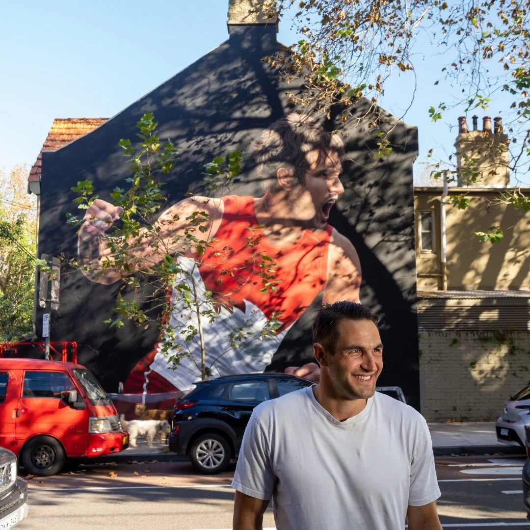 Are we seeing double?? 
The iconic Josh Kennedy paid a visit to our latest mural, and we are starstruck 🤩

#SydneySwans #Swans #AFL #Footy #RedandWhite #Sport #Athlete #Icon #AussieLegend #Mural #Murals #Streetart #Streetartist #Painting #Paint #Wal