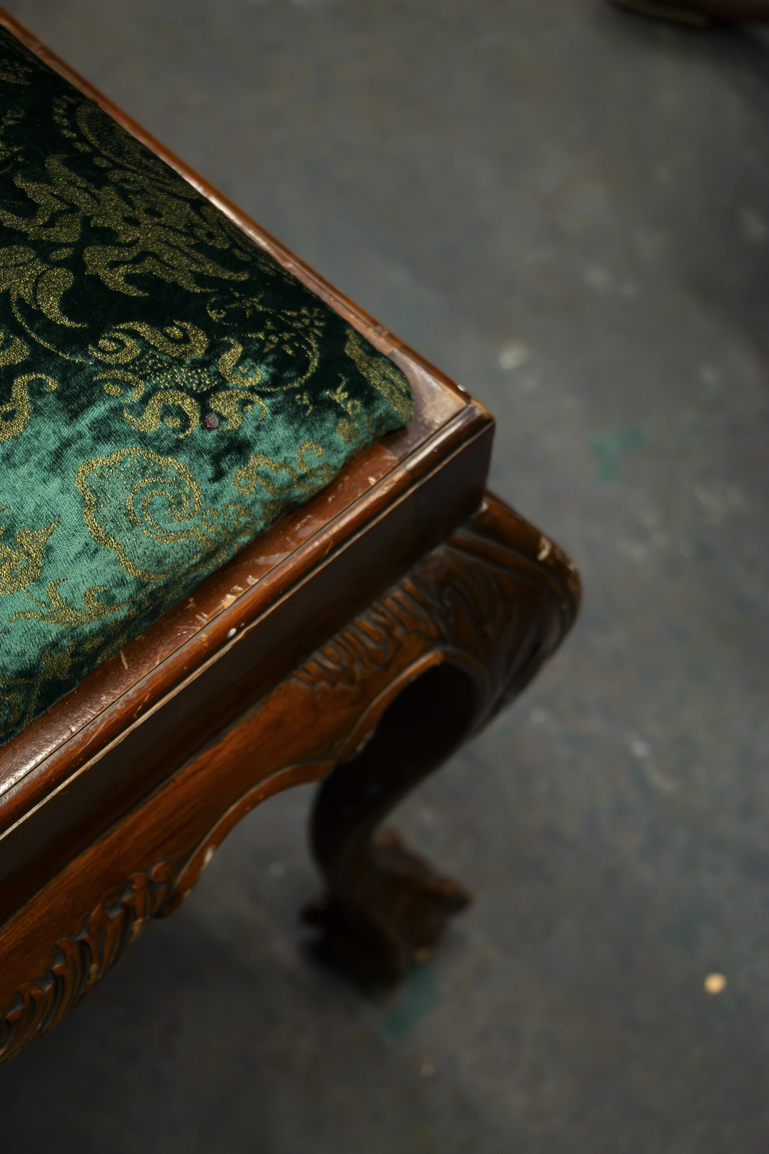 A green vintage chair, a set piece, for the upcoming play titled The Moors by the University of Washington School of Drama, at Seattle Wash. on Oct. 27, 3023. Du, designed this set to encapsulate the chaos and mystery that is hidden behind the facade