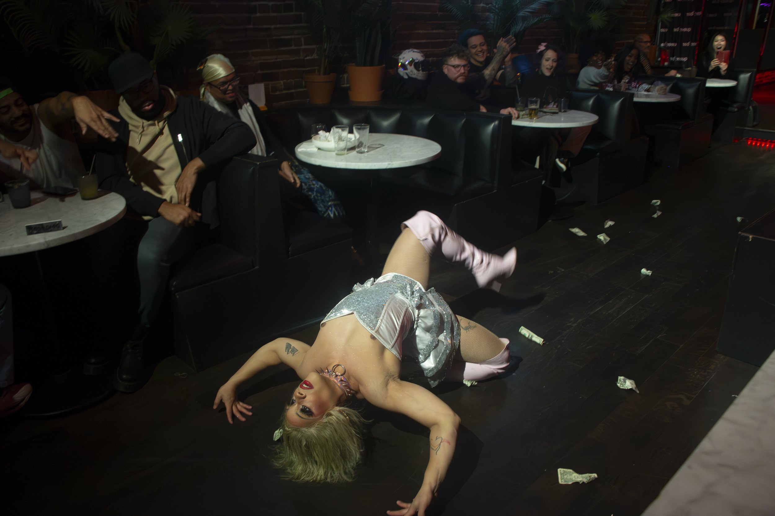 Glenn Coco performs the dip -- a dance move originating from the ballroom culture during her number at the Bronze Babez show at Queer/Bar, Seattle Wash. Nov. 29, 2023.