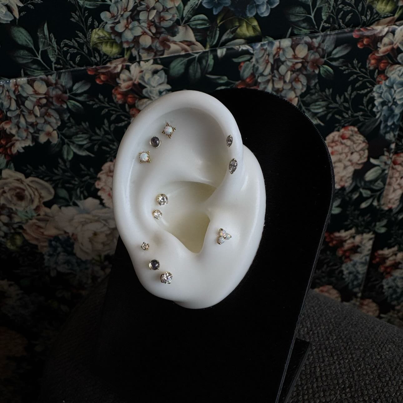 18k yellow gold ear curation by @emerald.cowgirl featuring white CZ, white opal, and genuine moonstone from @anatometalinc 🌸

We have a piercer on staff Tuesday through Saturday, noon-6pm! &bull; 

🥀@larosatattooco 
3307 S College Ave Unit 102-B
Fo