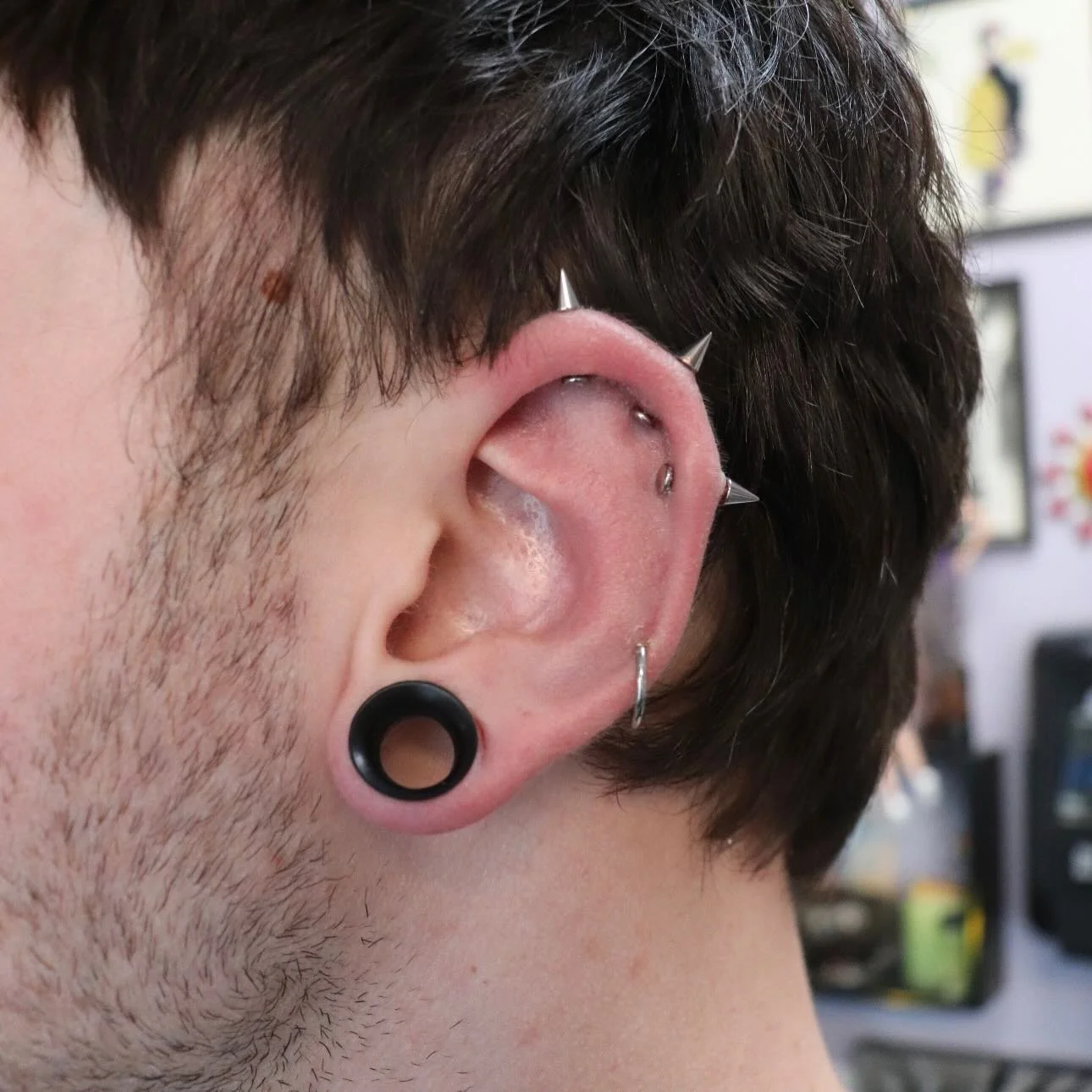 Triple vertical helix &amp; mid helix as a collaboration between @mothcults and @emerald.cowgirl ⛓️ implant grade titanium from @peoples_jewelry ⚔️

We have a piercer on staff Tuesday through Saturday, noon-6pm! &bull; 

🥀@larosatattooco 
3307 S Col