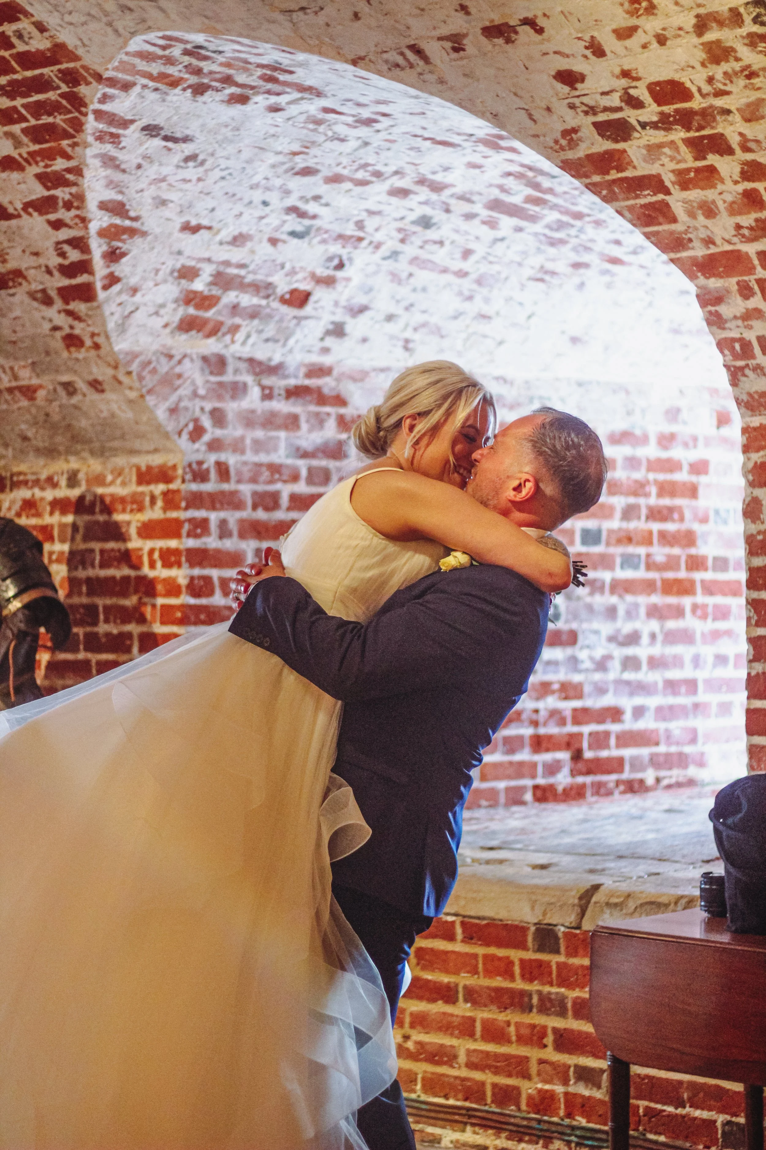 An intimate glimpse into the cherished moments of Kelly and Karl, residents of historical Portsmouth, as they exchanged vows within the storied walls of Southsea Castle.
