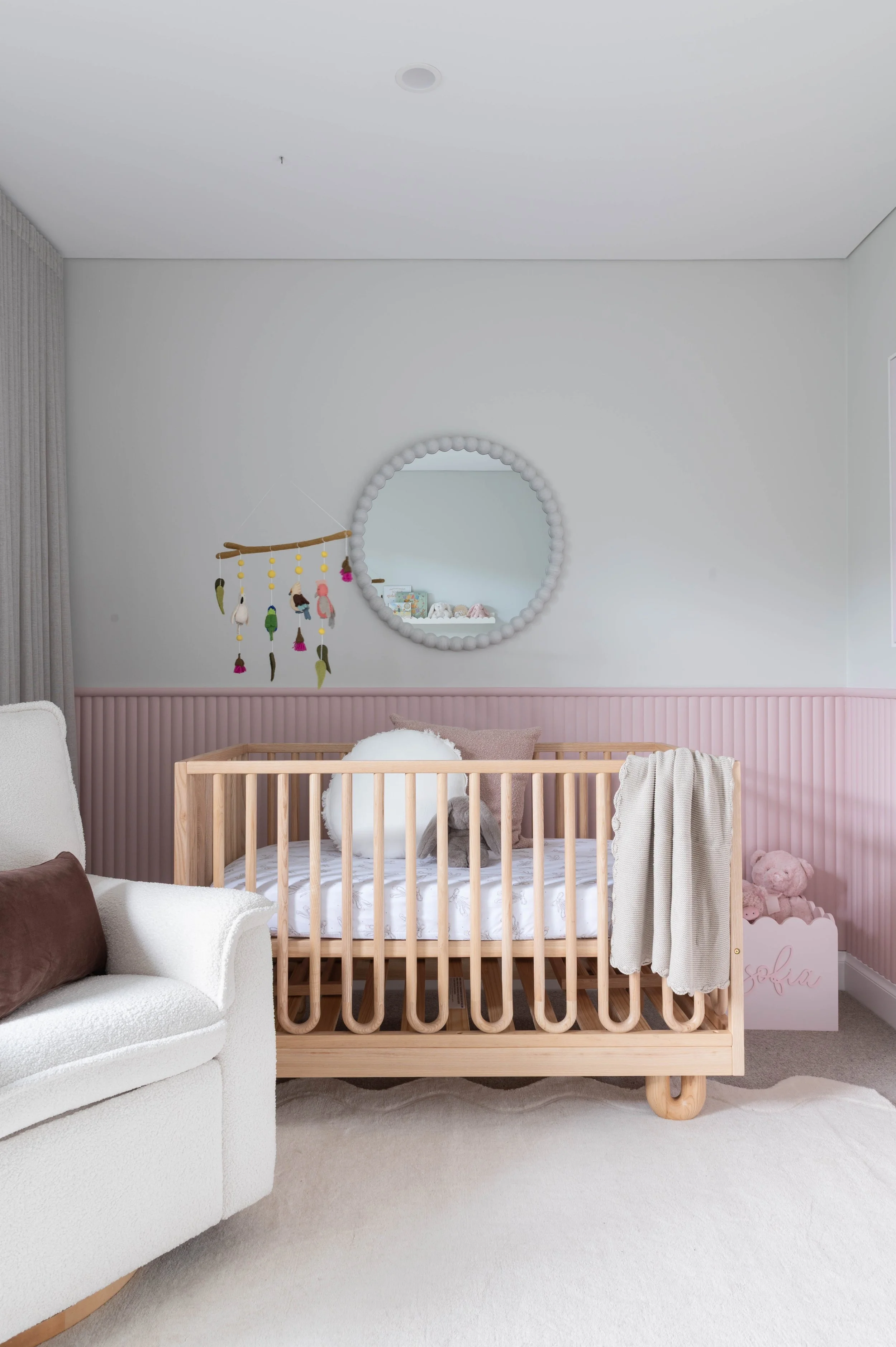 Surround by Laminex Convex wall cladding painted light pink in a nursery