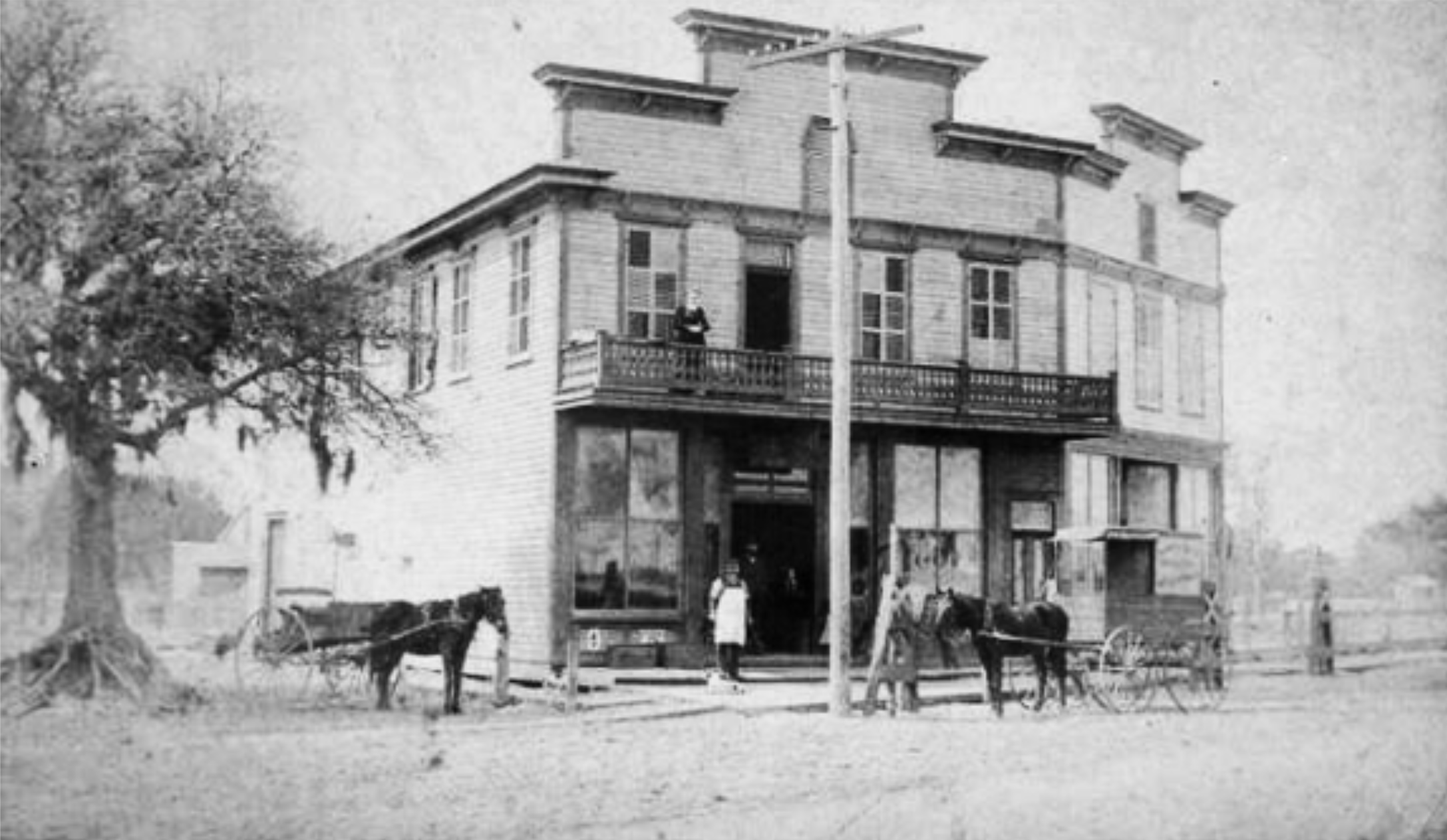 "Main Street just north of Broad Street (1886). This is a Grocer/Hardware/Drug store facing the old Court House where the Browning (King) Insurance building is today. The drug store was owned by A.N. Chelf Sr. His son would move the pharmacy to the J