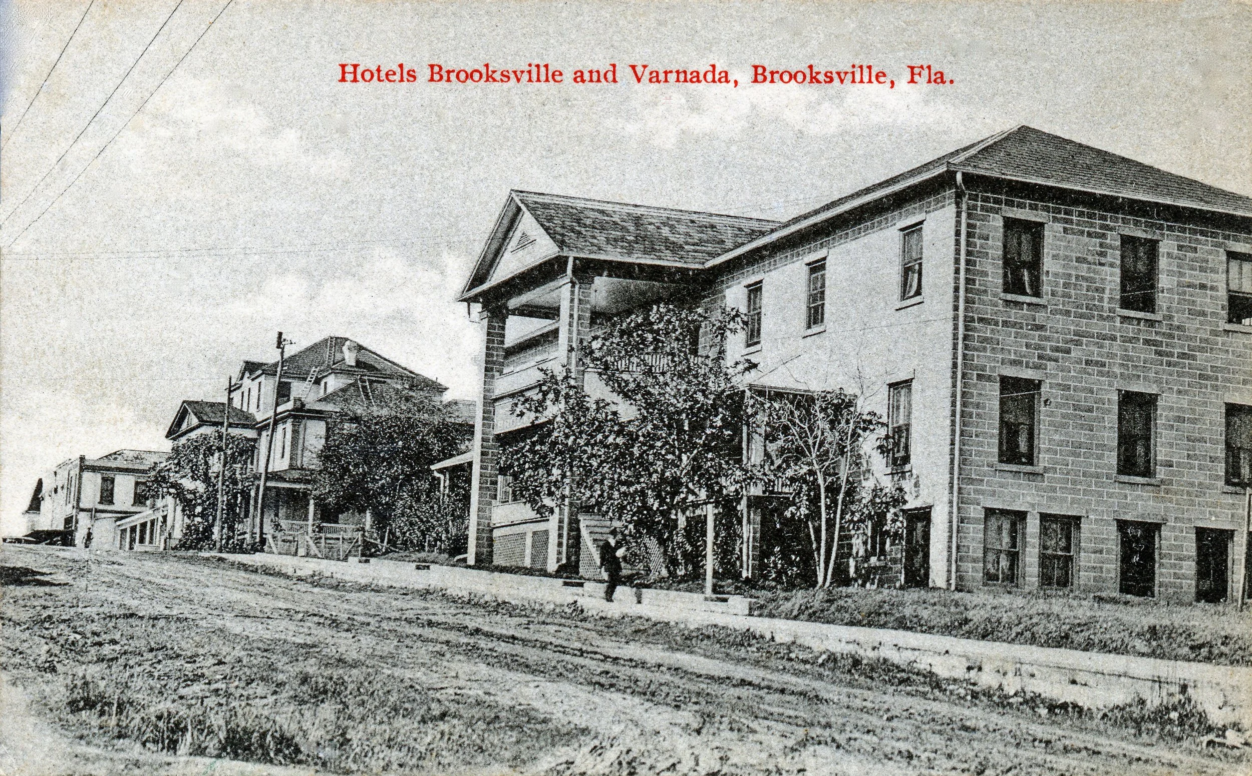 The Varnada Hotel is the building to the left of the most prominent building in the postcard.