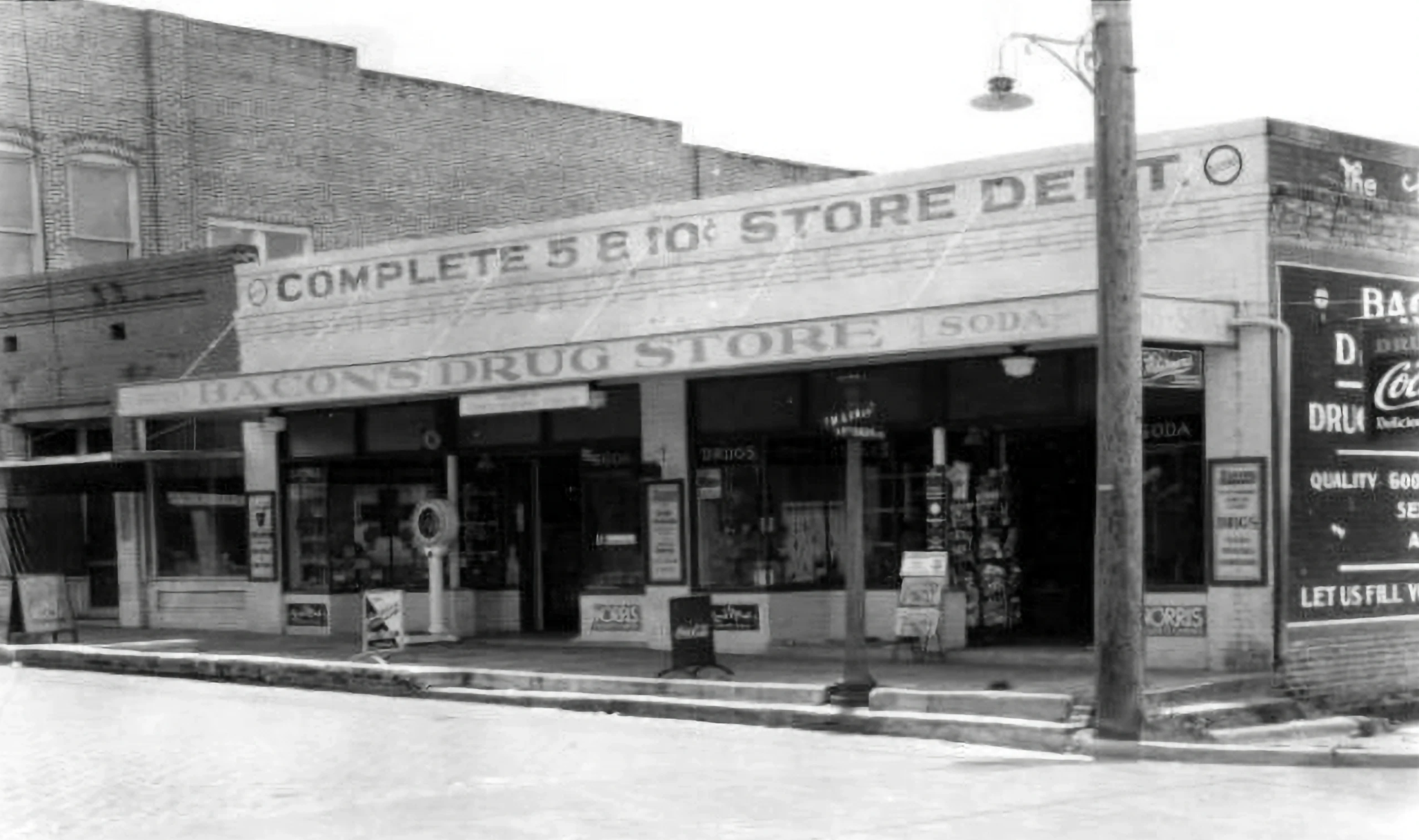 "Corner of North Main and Ft. Dade (1929). Bacon's Drug Store began here in 1926. This area is now occupied by the Morris Law Firm. Around 1936 Bacon's would switch corners and move to where the Main Street Eatery is today until the early 1970s." Rob