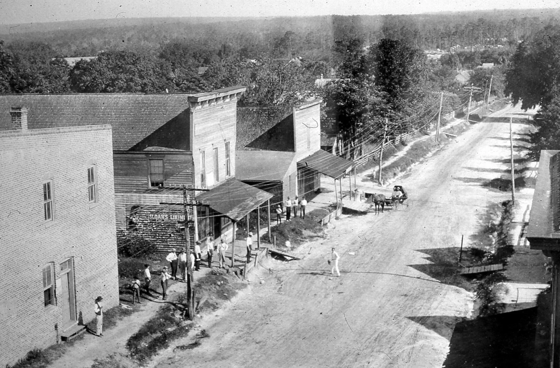 Roughly 1907 The Jennings building is the brick building on the left. This image is looking south on Main Street