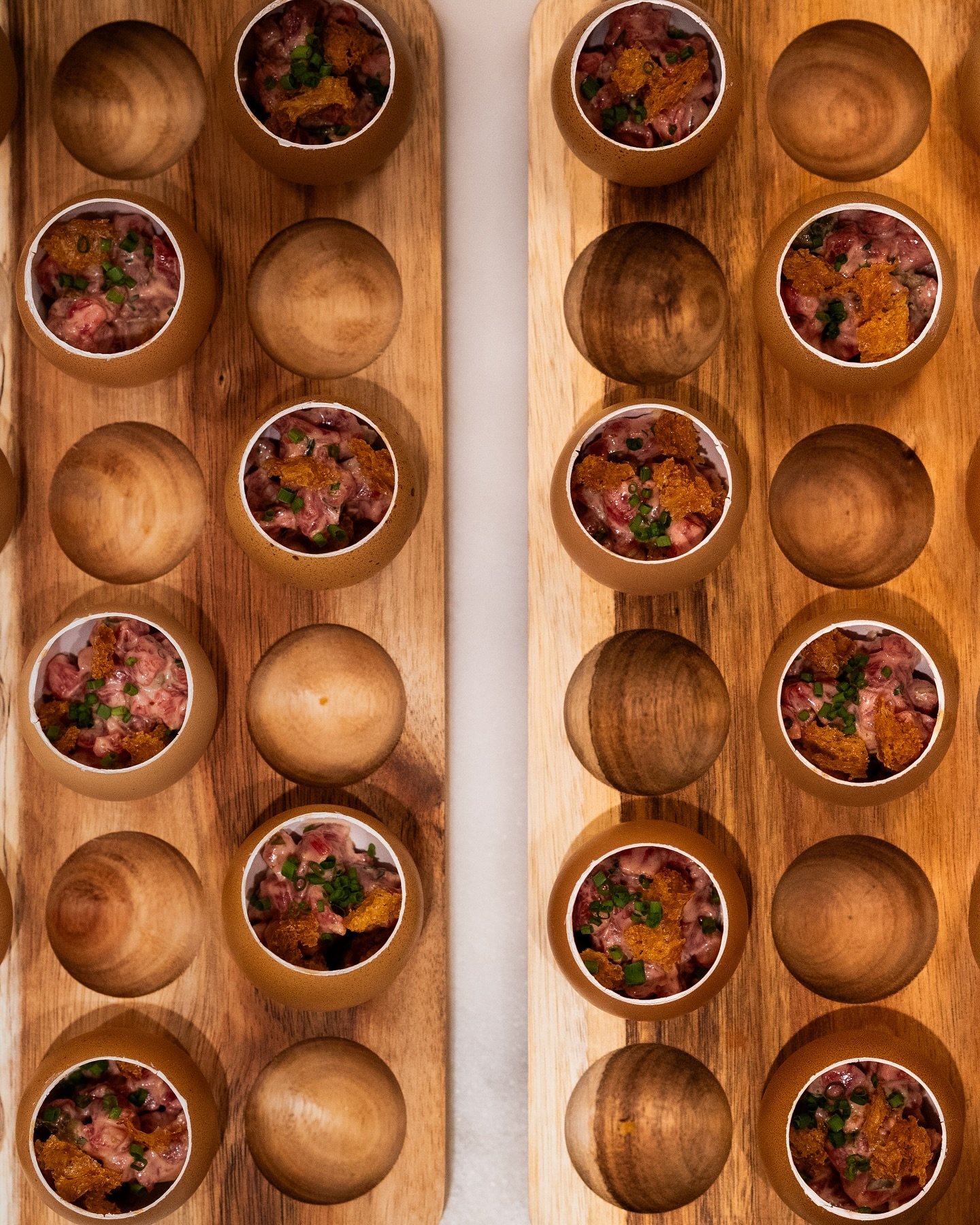 Our steak tartare canap&eacute;s with toasted sourdough and lots of egg yolk.