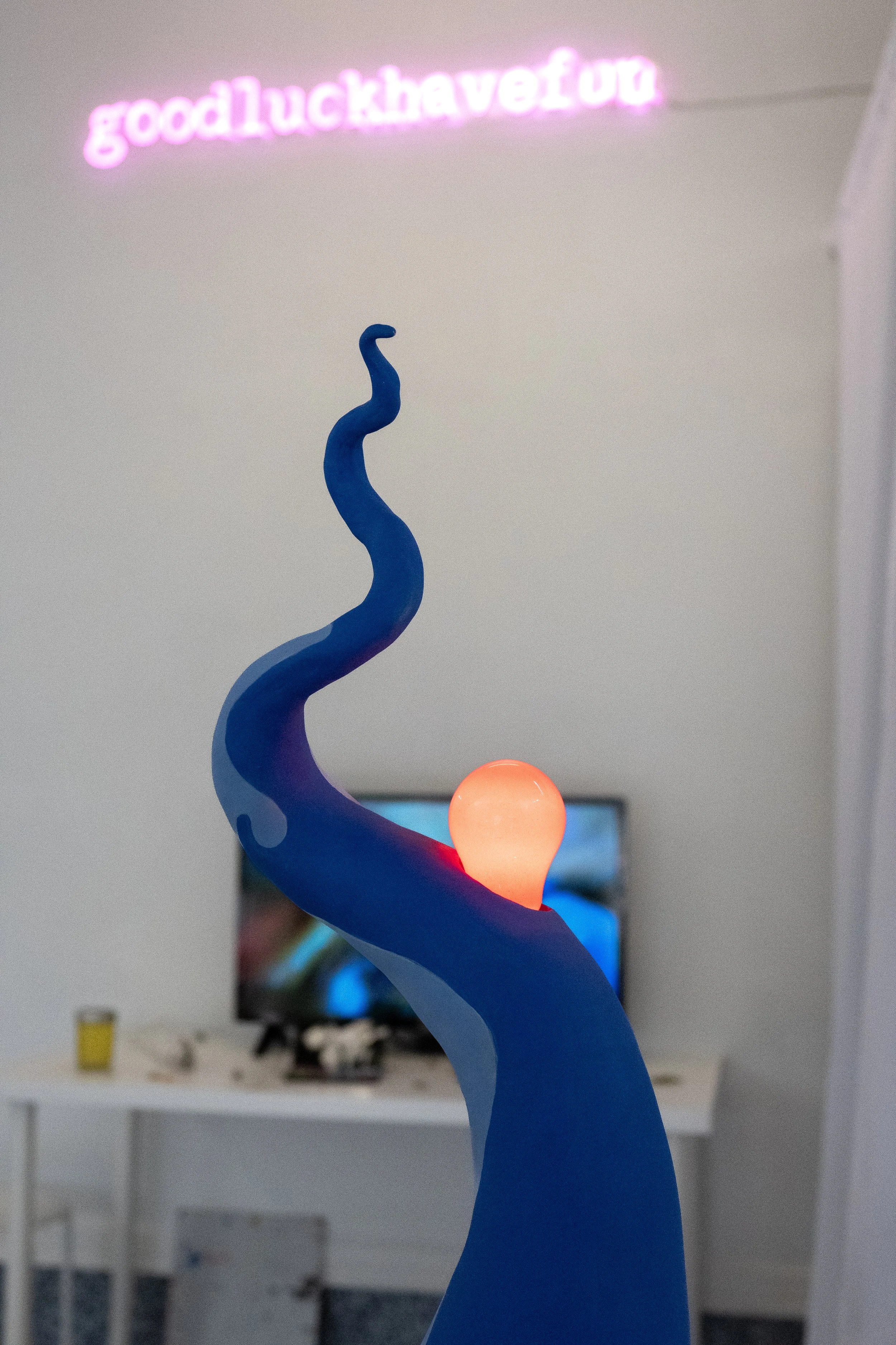 Tanya Zal  Blue Flame , 2021. Stoneware, underglaze, electrical lamp wiring, painted incandescent bulb.