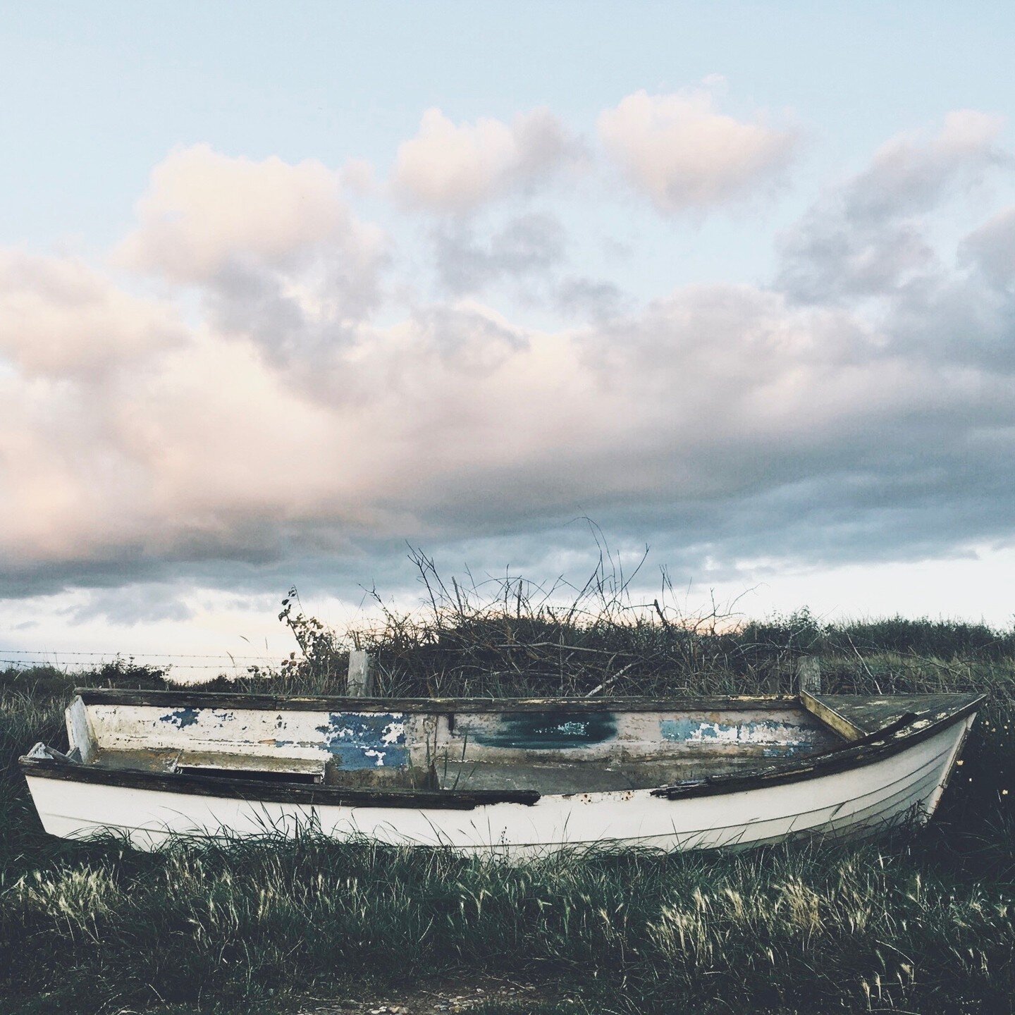 I took this photo years ago on a rare visit to Norfolk. I just thought it was really sad to see this old boat left to rot in a field out of sight away from the sea.⁣
⁣
We live in the most landlocked place in the country. Well, we don&rsquo;t actually