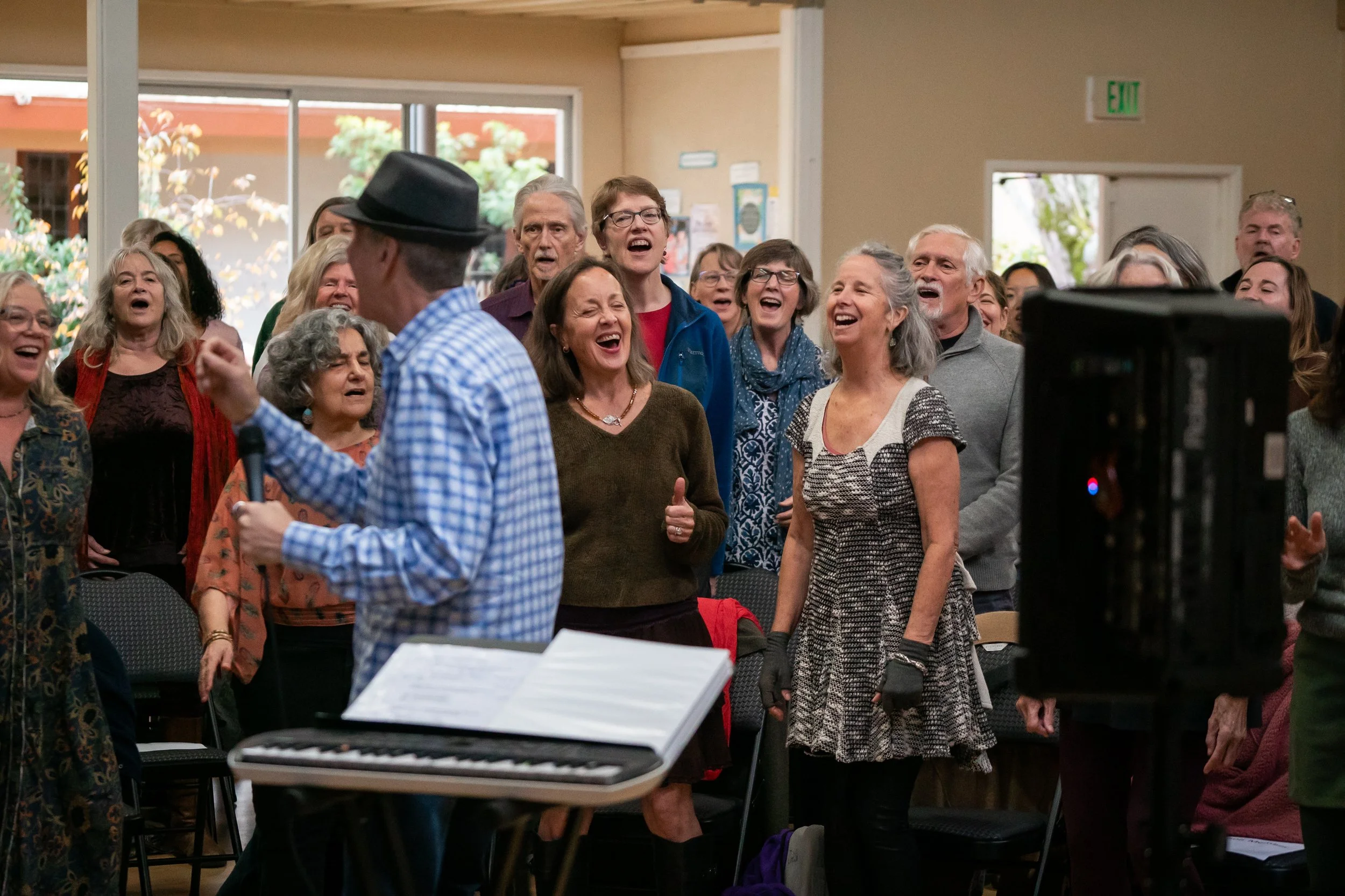 Joyful Voices Chorus Fall '24 Big Sing -- M w front row.jpg
