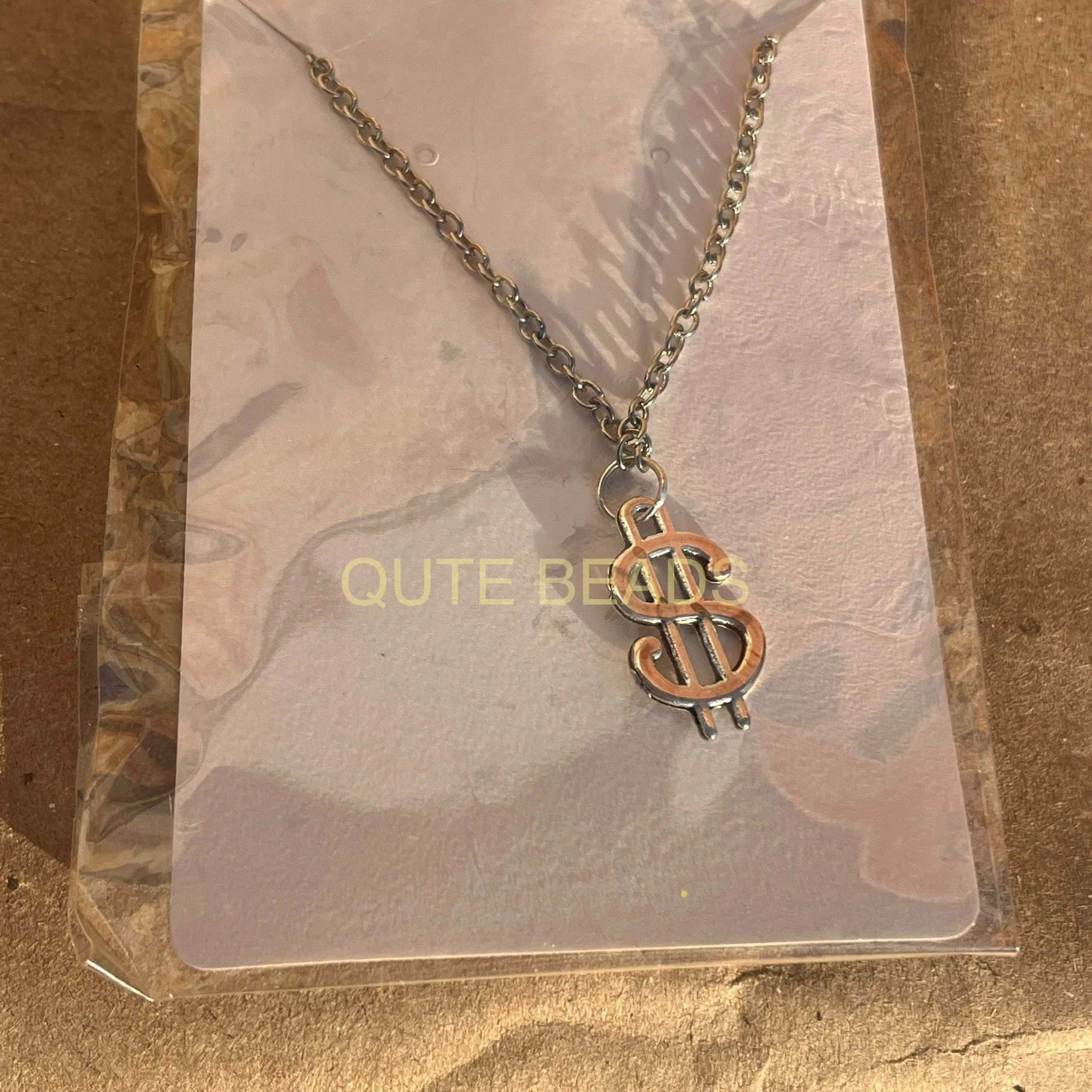 dollar sign necklace.jpg
