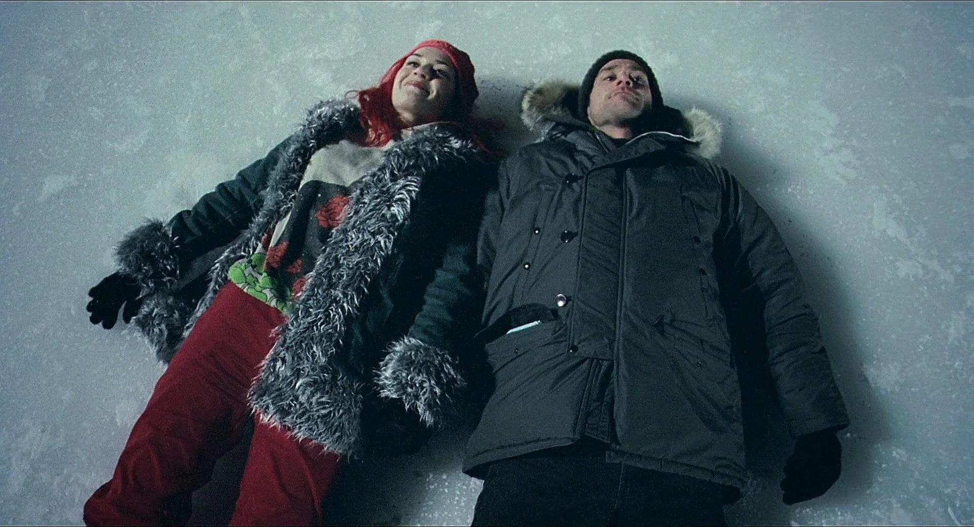 Clementine (Kate Winslet) and Joel (Jim Carrey) lie on a frozen lake together