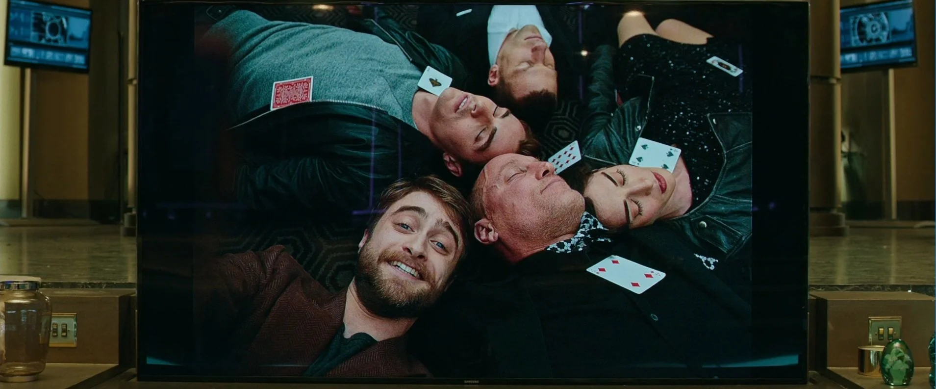Walter (Daniel Radcliffe) takes a picture of the Four Horsemen