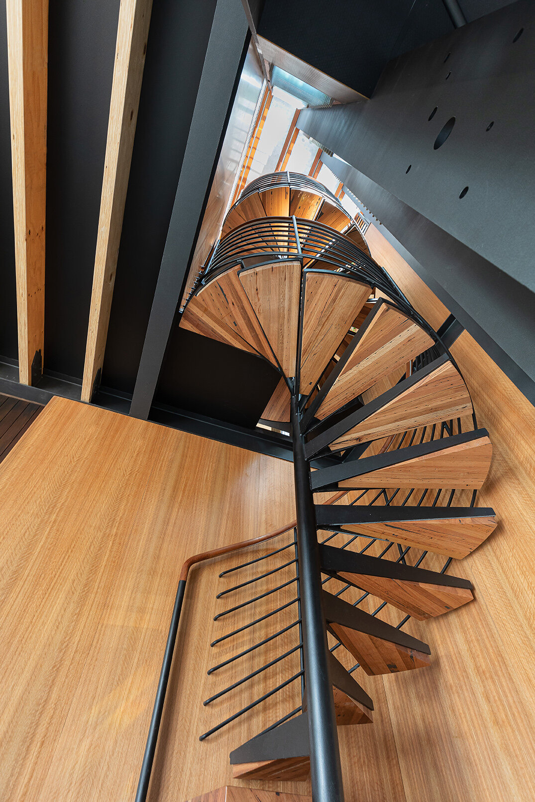 Interior view of staircase treads using recycled timber supplied by Architectural hardwood joinery.