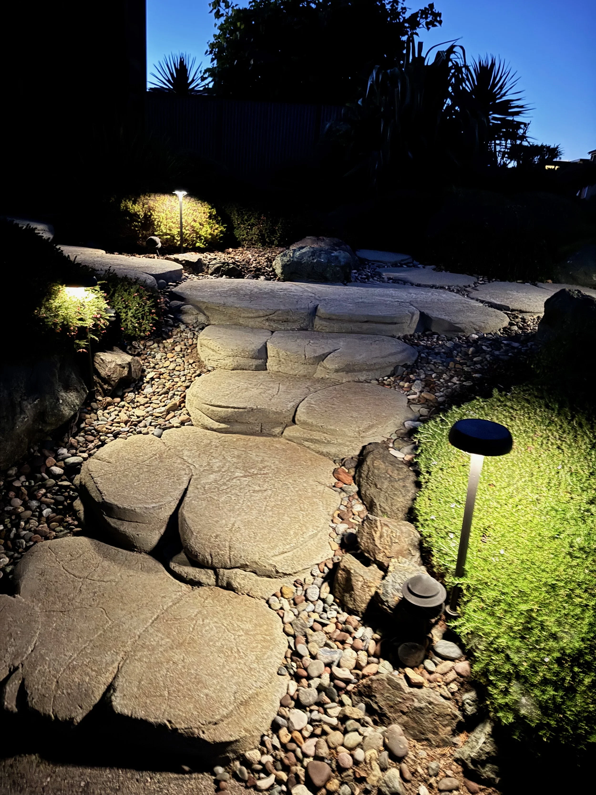 Front path at dusk with solar lights.