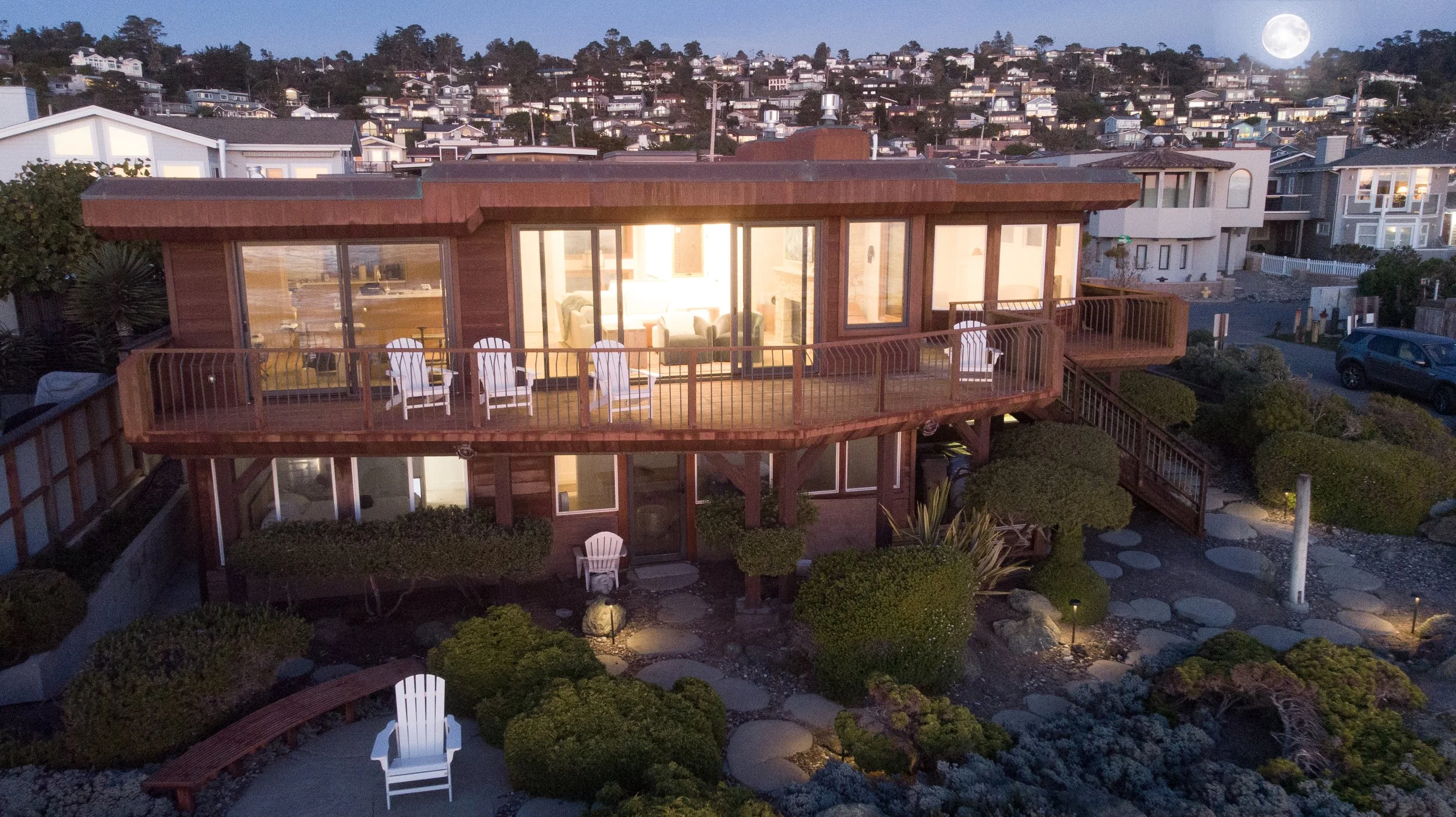 Sunset view as the full moon rises behind the Marine Terrace neighborhood in Cambria.