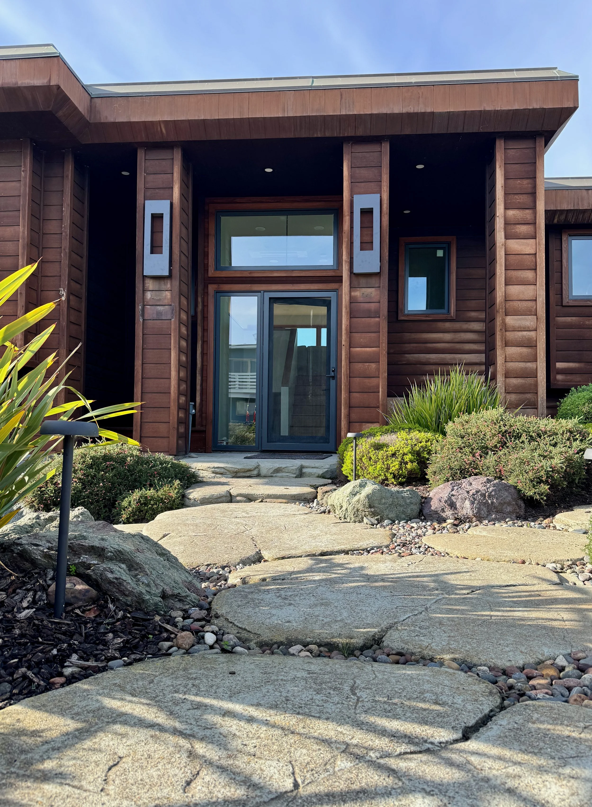 Front door of Oceanfront Cambria with motion sensor lights.