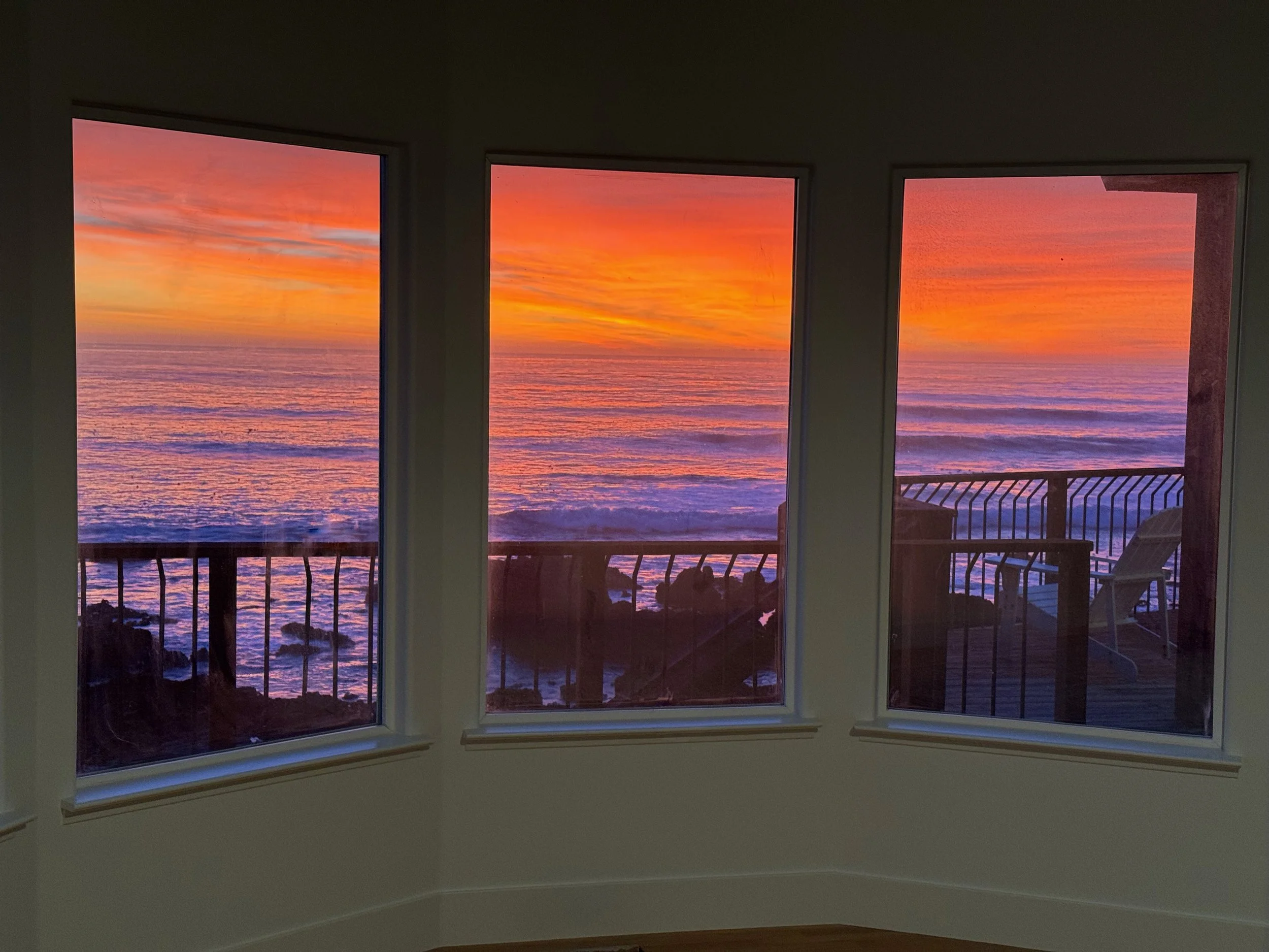 Actual sunset view from the newly remodeled master bedroom with its own cozy gas fireplace, king bed, and air conditioning for warm days.