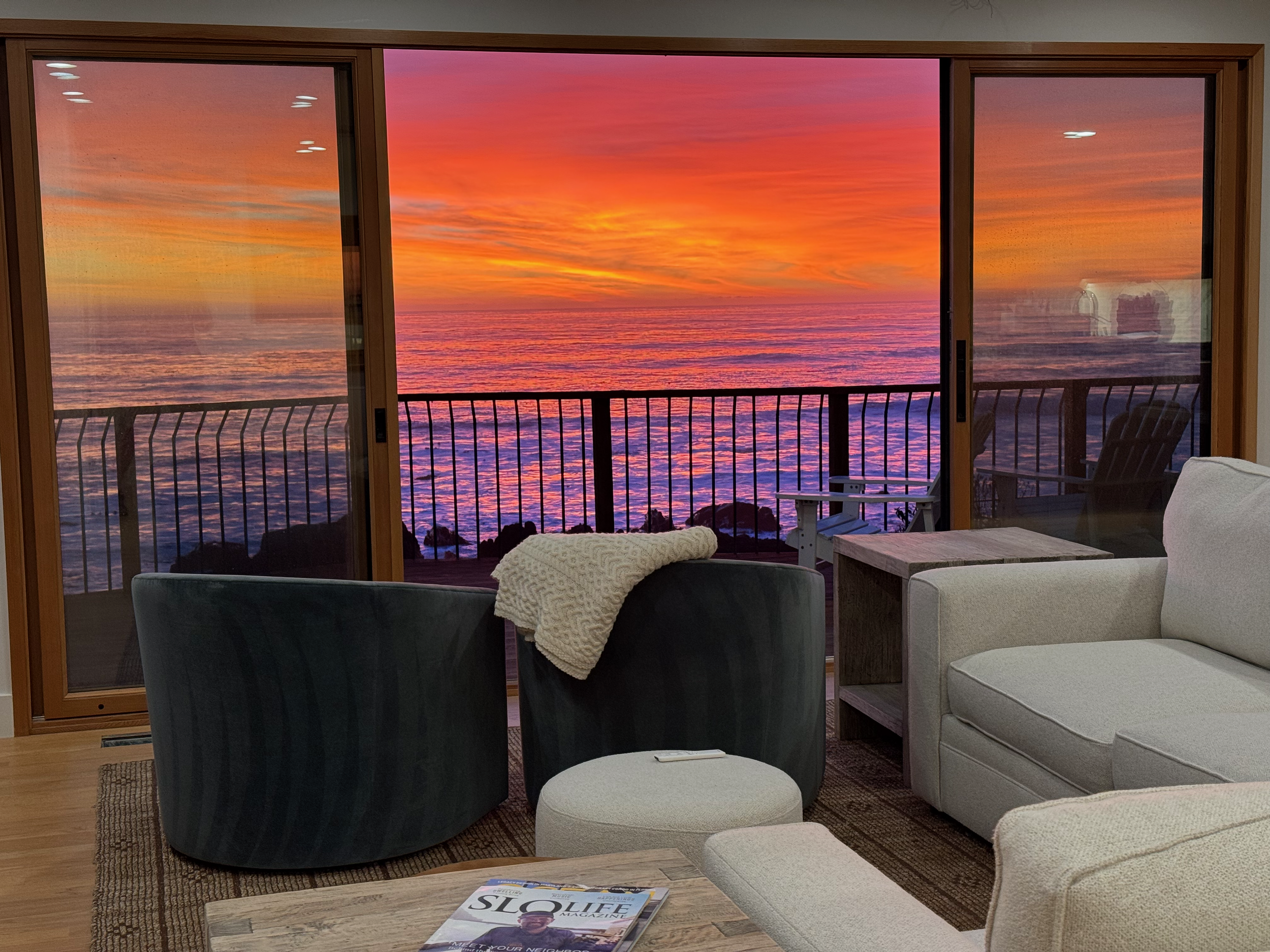 Spectacular sunset from the living room and balcony upstairs.  The master bedroom and both downstairs bedrooms have similar ocean views.