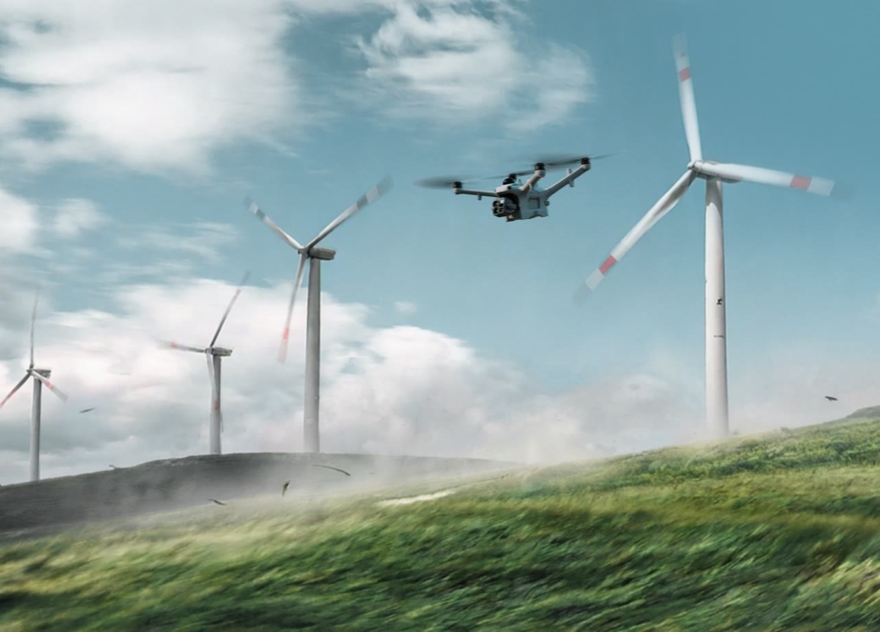 Matrice 5TD flying past wind turbines in strong wind