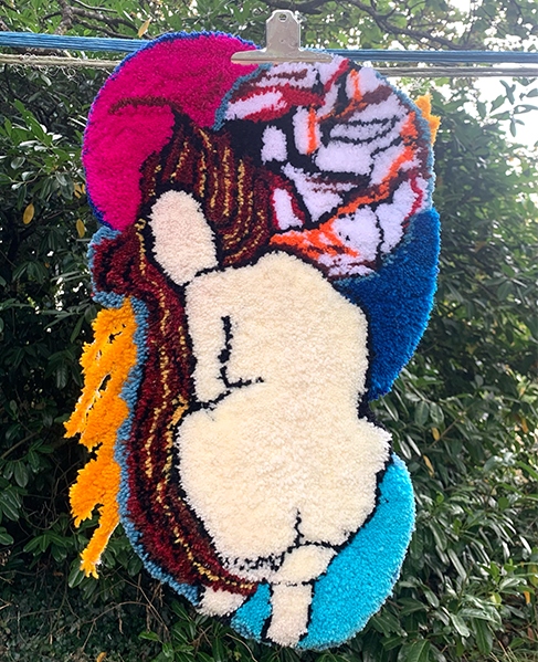 "Femme Fatale" acrylic yarn cut pile 56 cm x 32 cm inspired by one of my sticker design. This rug is designed by Clementine Eastwood.