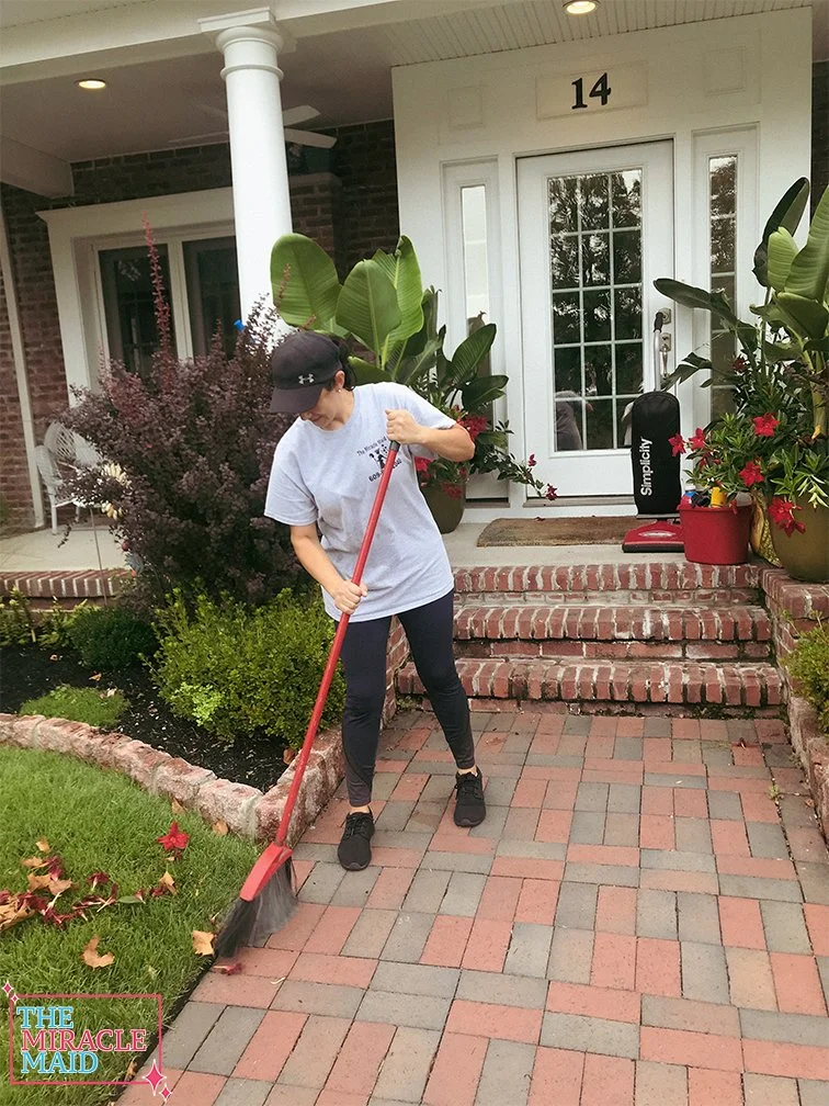 MiracleMaid_SweepingHouseFront.jpg