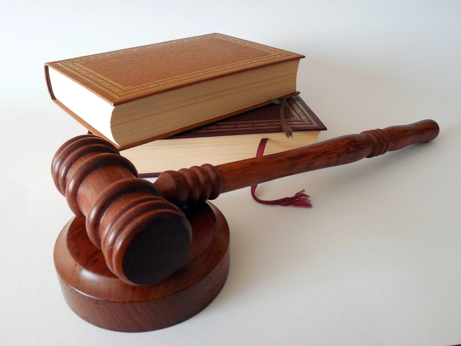 Image showing a judge's hammer and legislation book.