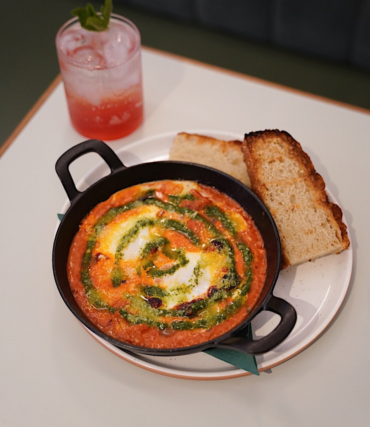 Neighbourhood Baked Eggs
Eggs baked in housemade vodka sauce - a rich and creamy vodka marinara with a gentle chilli kick, parmesan &amp; basil oil, served with @benchmark_bread focaccia